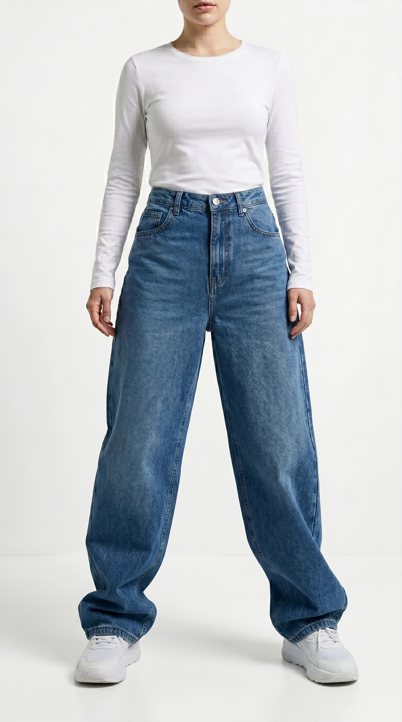 Person wearing a white long-sleeve shirt and blue jeans on a white background, Relaxed Fit Egyptian cotton jeans from Meleche Fashion USA or Meléche (short as (Mé))