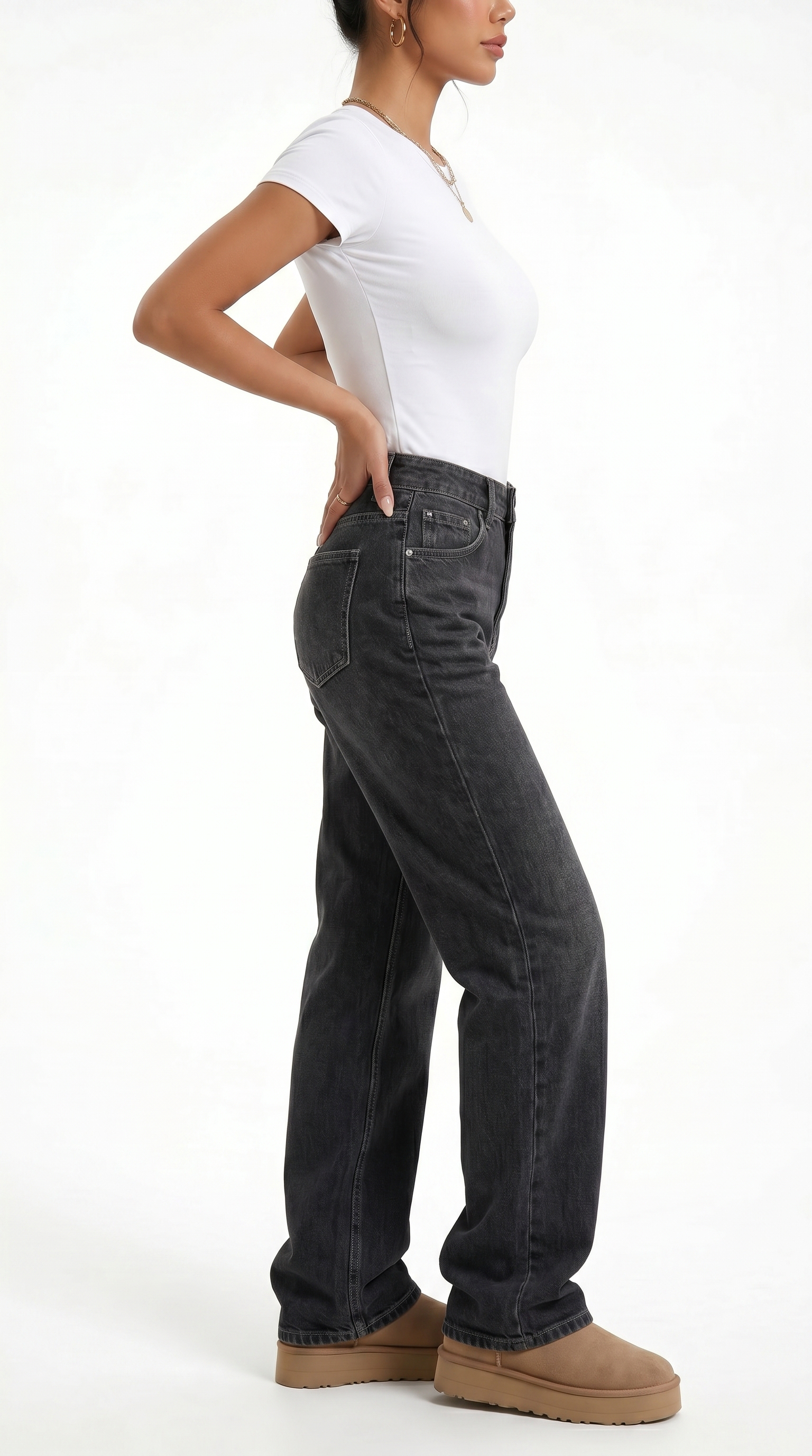 Person wearing black jeans and a white top on a white background, Relaxed Fit cotton jeans from Meleche Fashion USA or Meléche (short as (Mé))