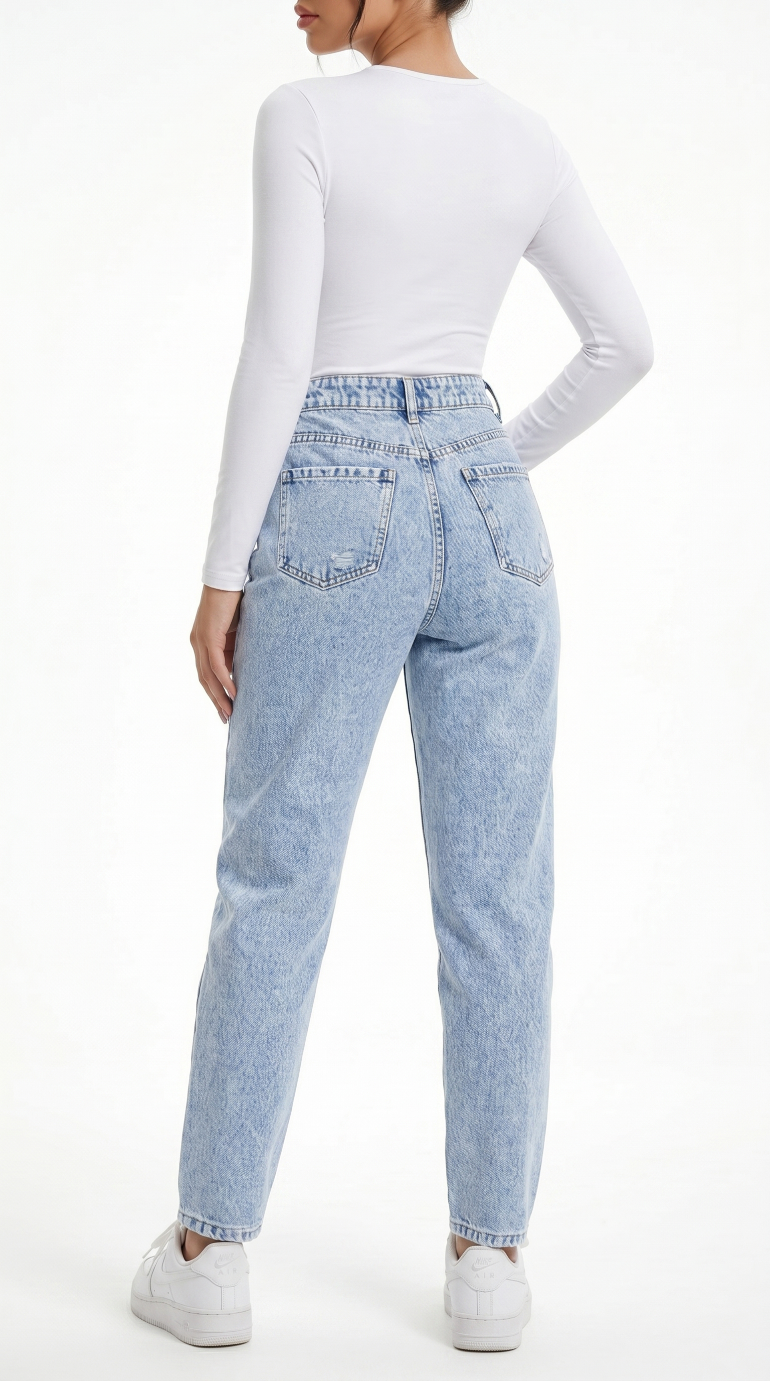 Person wearing light blue jeans and a white long-sleeve top on a white background, Slim sexy jeans from Meleche Fashion USA or Meléche (short as (Mé))