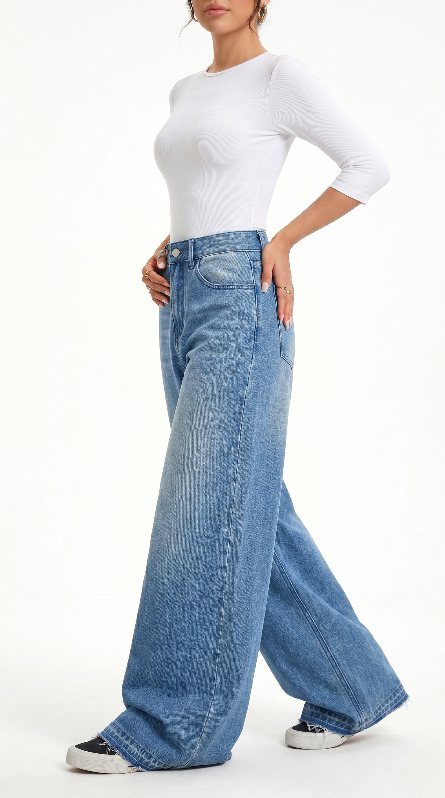 Person wearing a white long-sleeve top and blue wide-leg jeans on a white background, Wide-leg Egyptian Cotton jeans from Meleche Fashion USA or Meléche (short as (Mé))