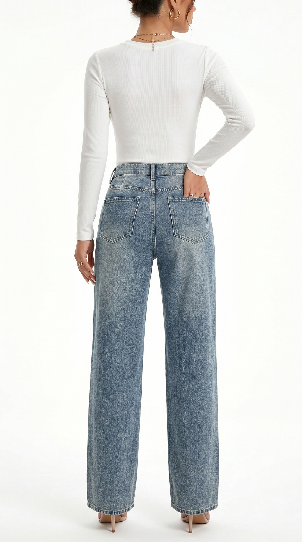 Person wearing light blue jeans and a white long-sleeve top on a white background, Wide-leg jeans from Meleche Fashion USA or Meléche (short as (Mé))