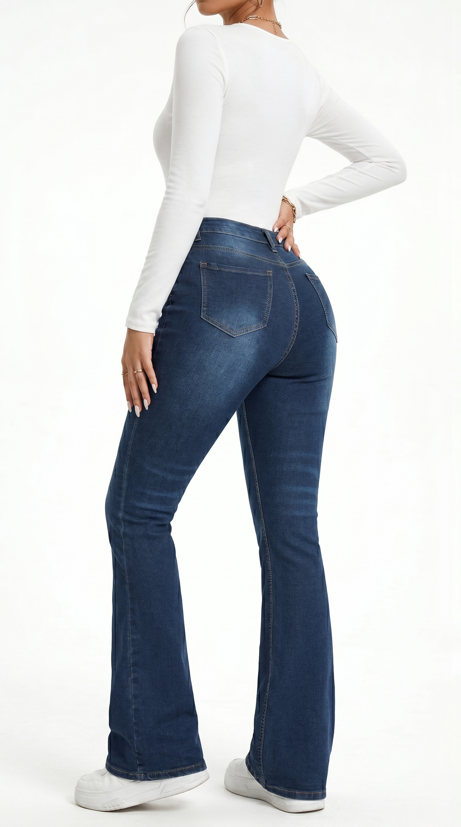 Person wearing blue jeans and a white long-sleeve shirt on a white background , Slim flares jeans from Meleche Fashion USA or Meléche (short as (Mé))