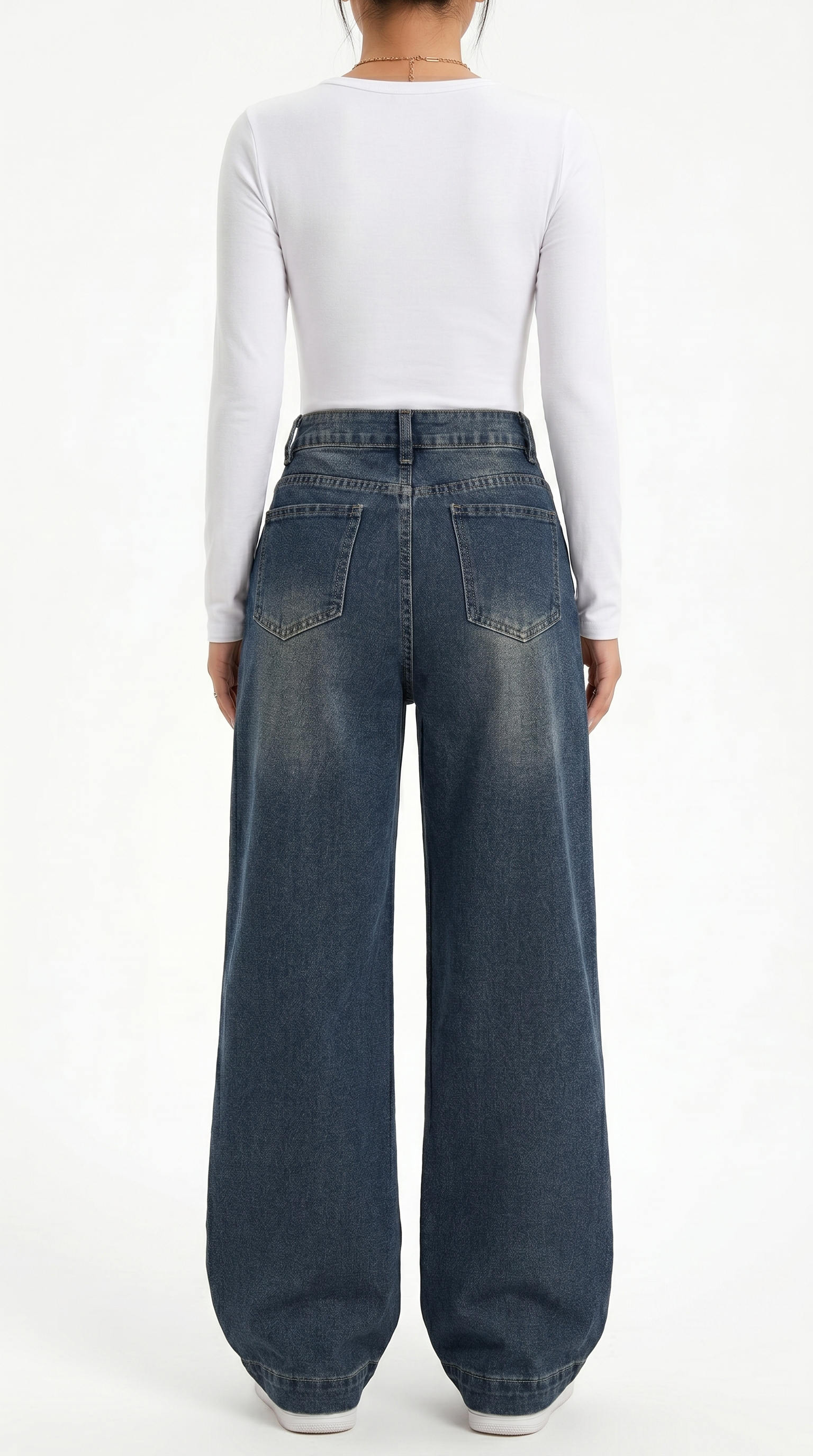 Person wearing blue wide-leg jeans and a white long-sleeve shirt on a white background, wide jeans from Meleche Fashion USA or Meléche (short as (Mé))