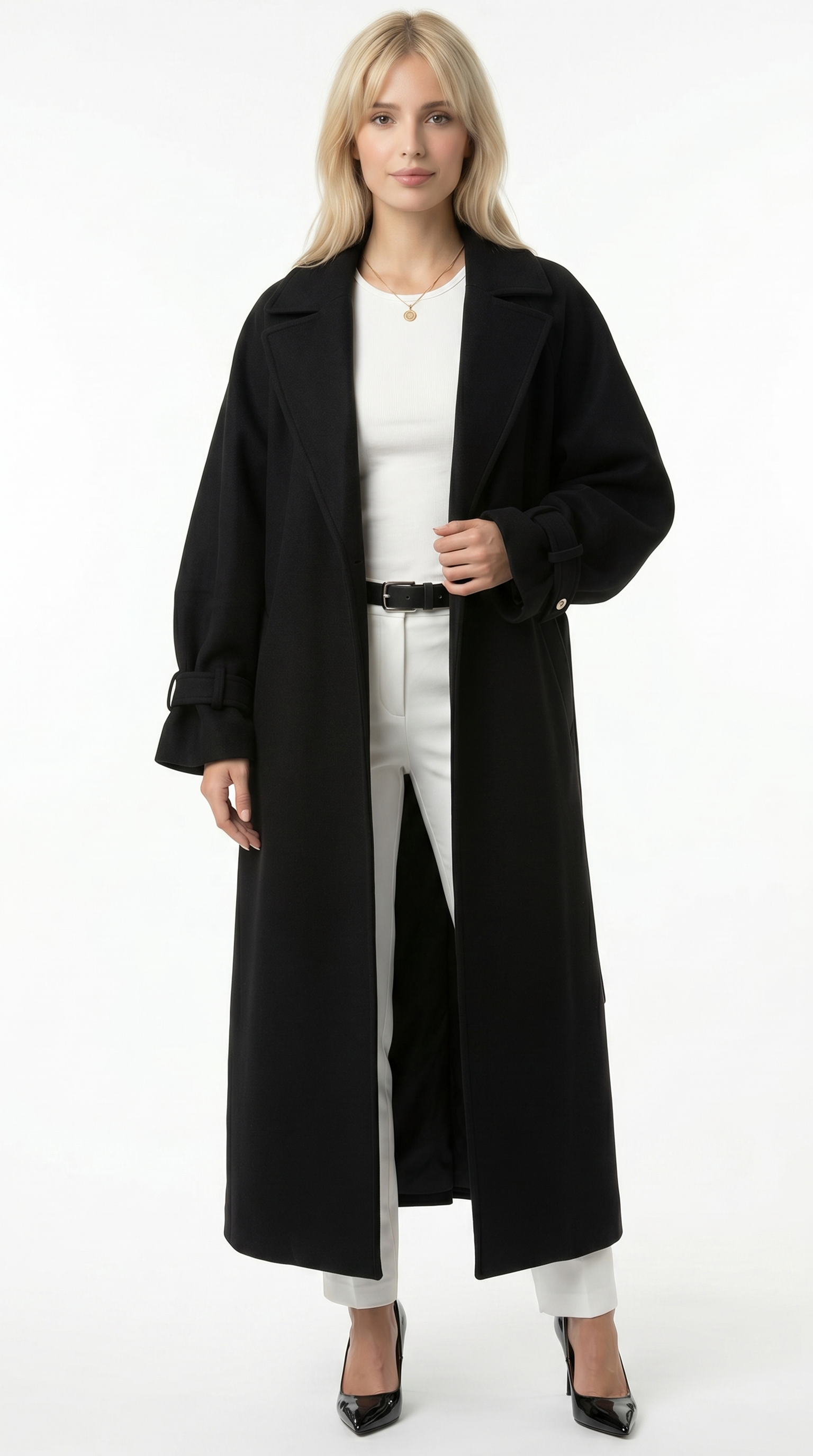 Woman wearing a long black coat over a white outfit on a white background from Meleche or Meléche USA (short as (Mé))