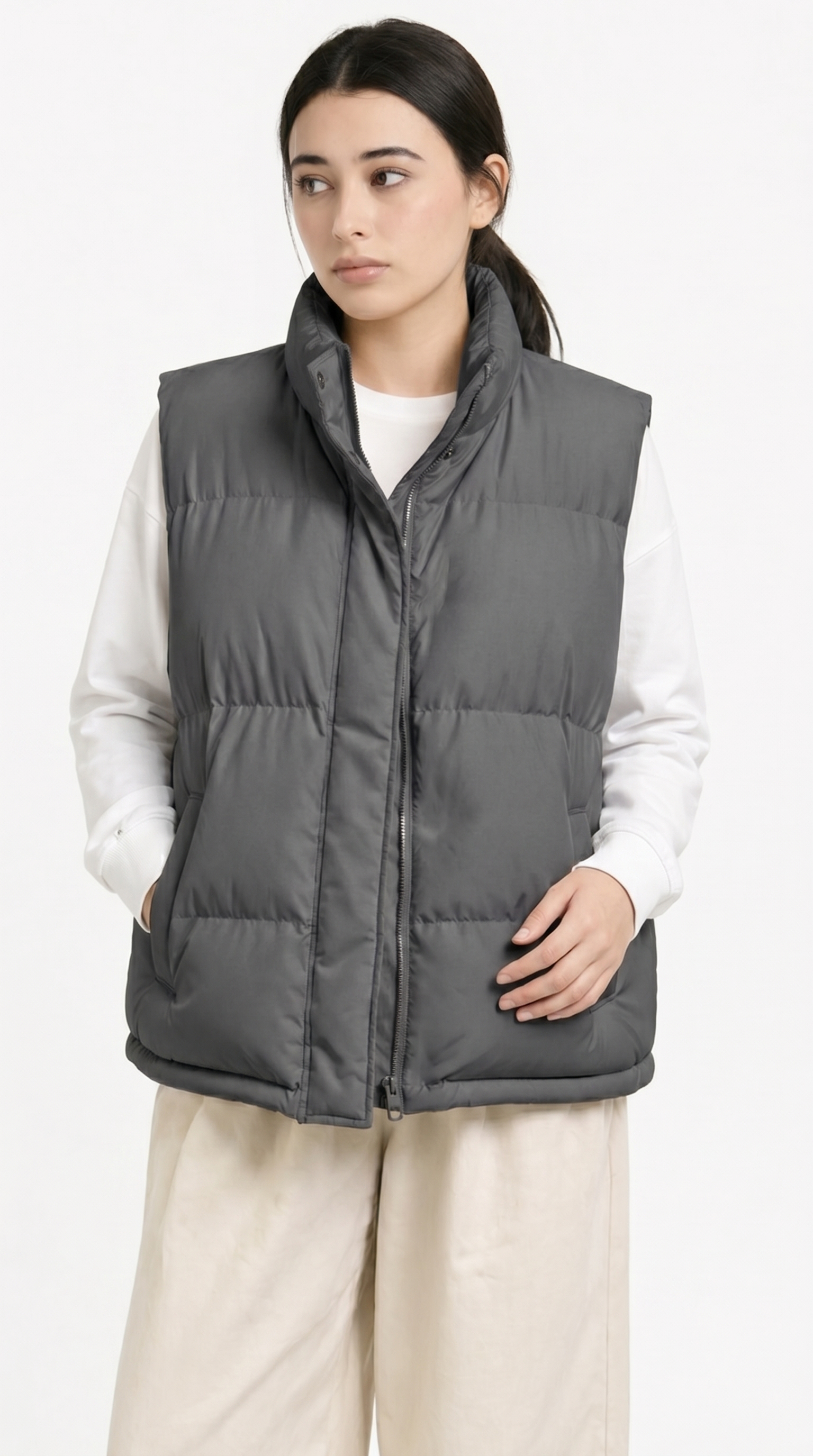 Person wearing a gray puffer vest over a white shirt on a white background from Meleche Fashion USA or Meléche (short as (Mé))
