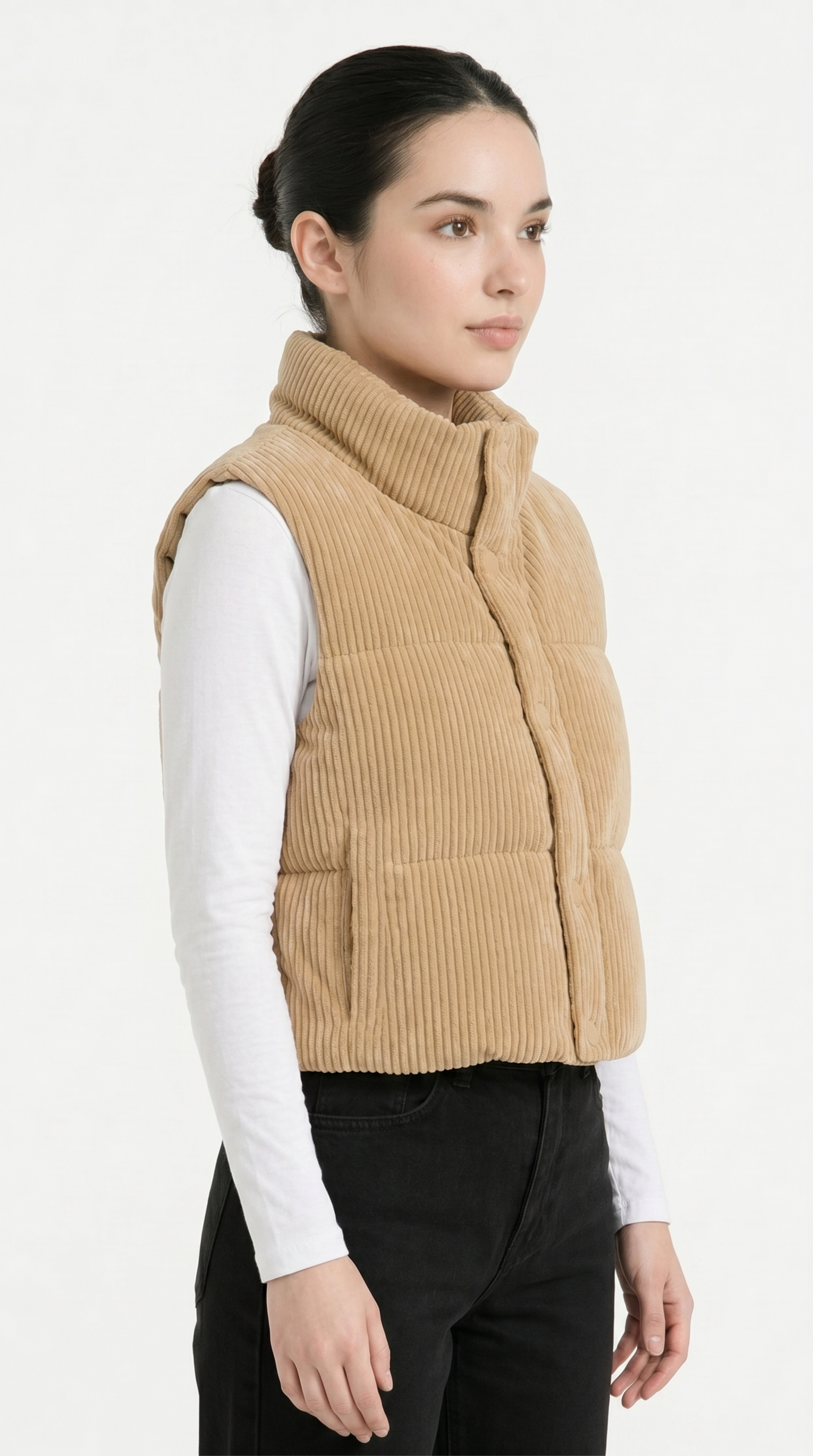 Woman wearing a beige quilted vest on a white background from Meleche Fashion USA or Meléche (short as (Mé))