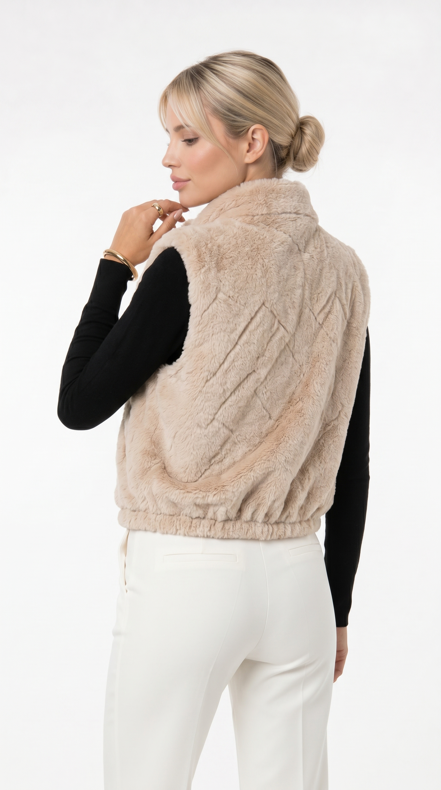 Woman wearing a beige fleece vest over a black long-sleeve shirt and white pants on a white background from Meleche Fashion USA or Meléche (short as (Mé))