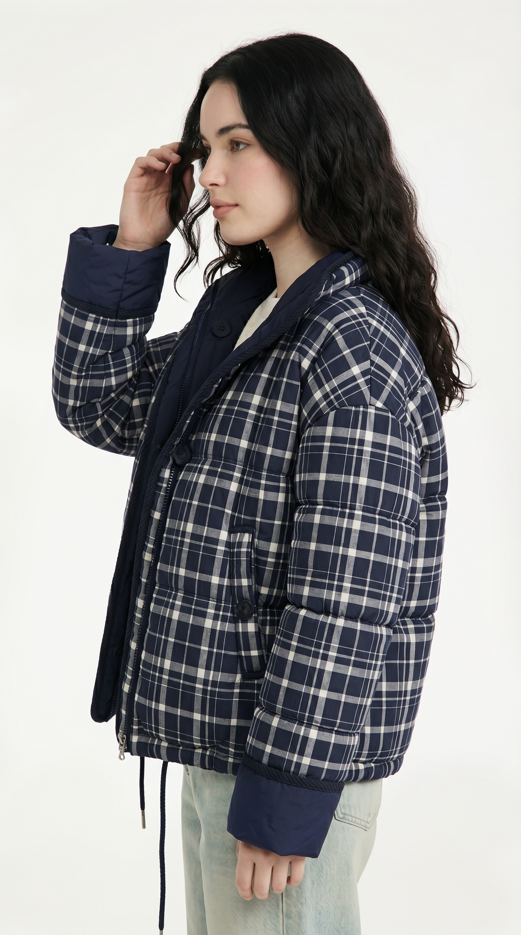 Woman wearing a blue plaid jacket on a white background from Meleche USA or Meléche (short as (Mé))