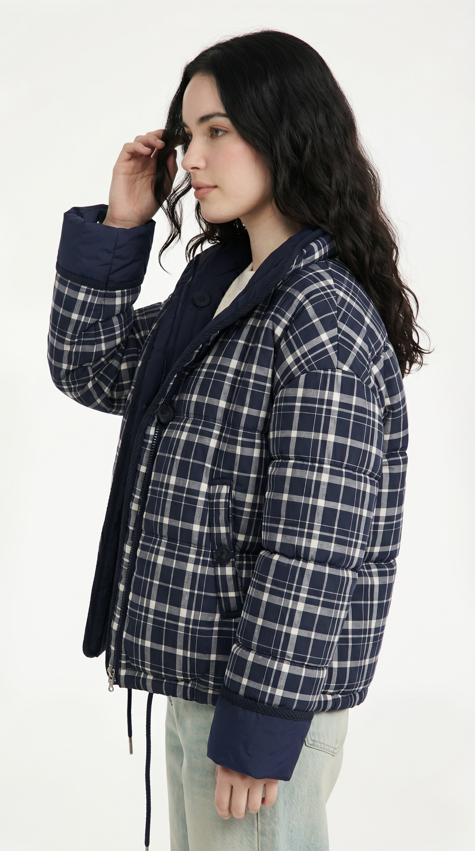 Woman wearing a blue plaid jacket on a white background from Meleche USA or Meléche (short as (Mé))
