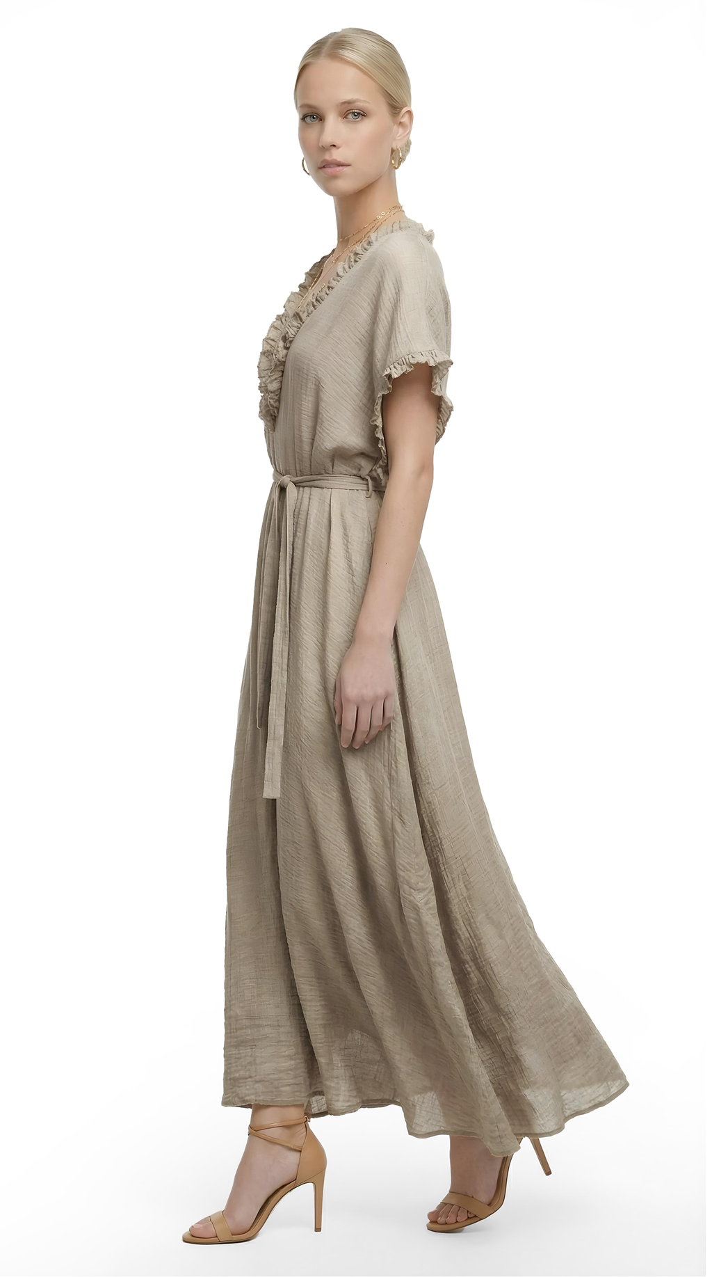 Woman wearing a beige dress with lace details on a white background