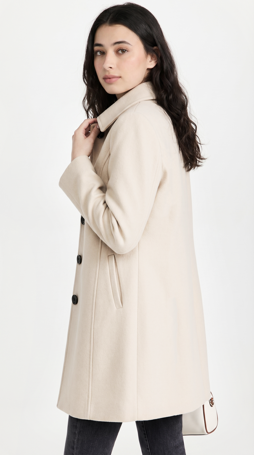 Woman wearing a beige coat on a white background from Meleche or Meléche USA (short as (Mé))