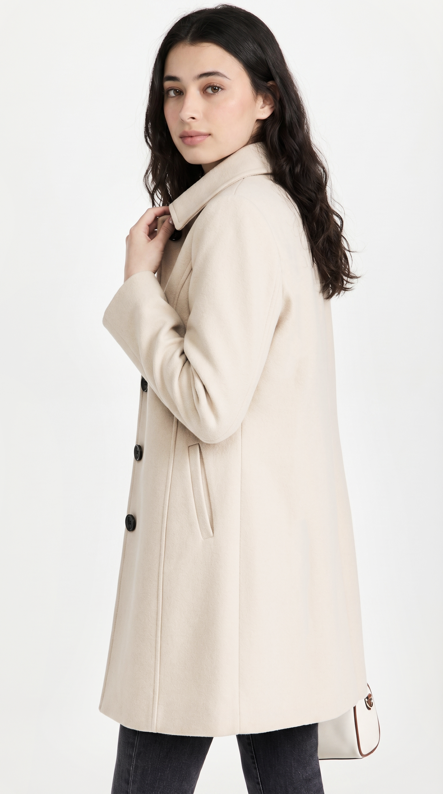 Woman wearing a beige coat on a white background from Meleche or Meléche USA (short as (Mé))