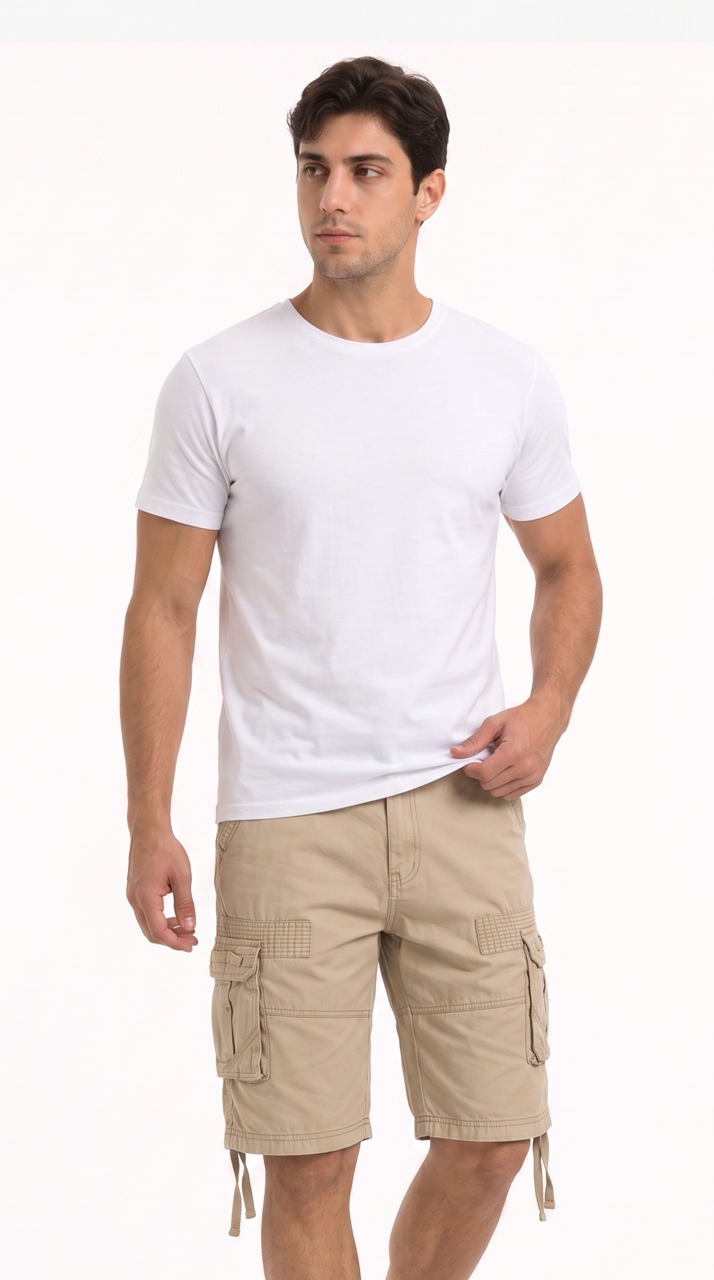A man wearing a plain white short-sleeve crewneck t-shirt and beige cargo shorts, standing against a solid white studio background, from Meleche Fashion USA or Meléche (short as (Mé))