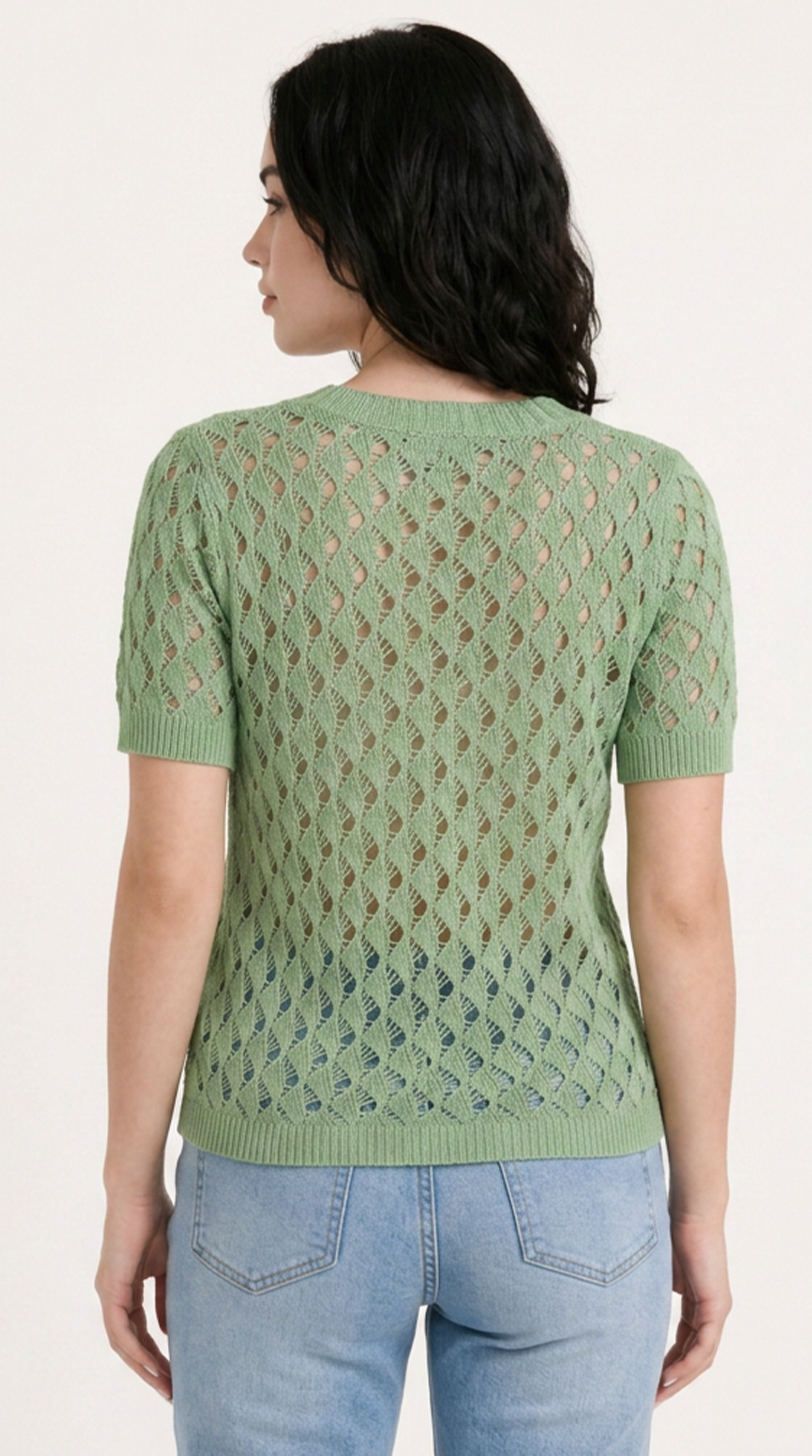 Woman wearing a green knitted sweater with a textured pattern on a plain background, from Meleche Fashion USA or Meléche (short as (Mé))