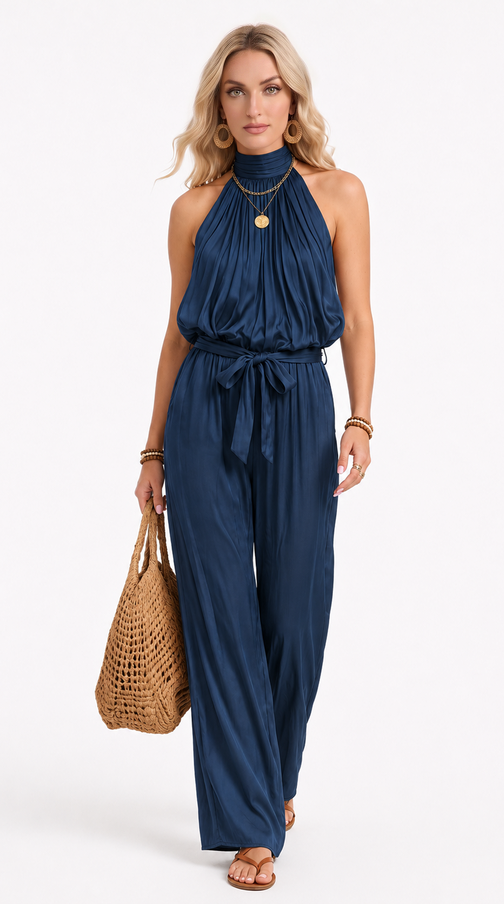 Woman wearing a navy blue jumpsuit holding a woven bag on a white background, from Meleche Fashion USA or Meléche (short as (Mé))