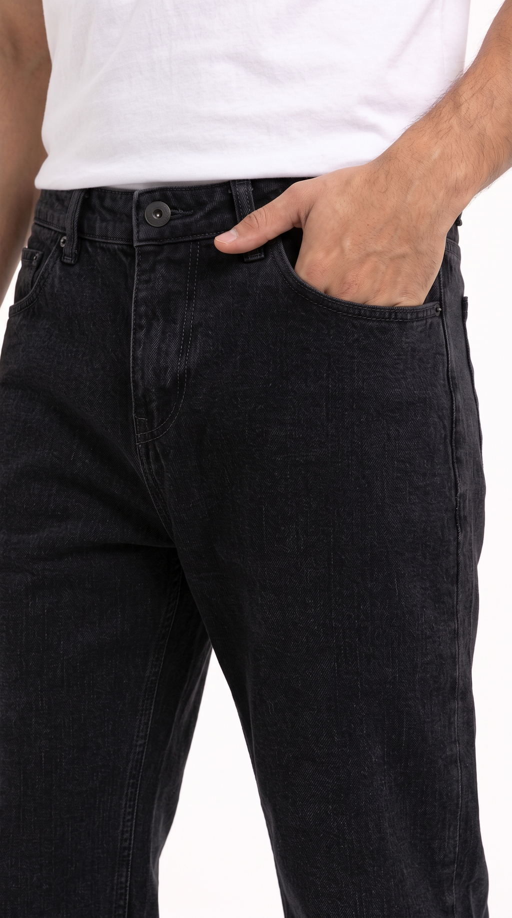 Close-up of a person wearing black denim jeans with a white tank top, showing the front pocket and side pocket with one hand in the pocket, from Meleche Fashion USA or Meléche (short as (Mé))