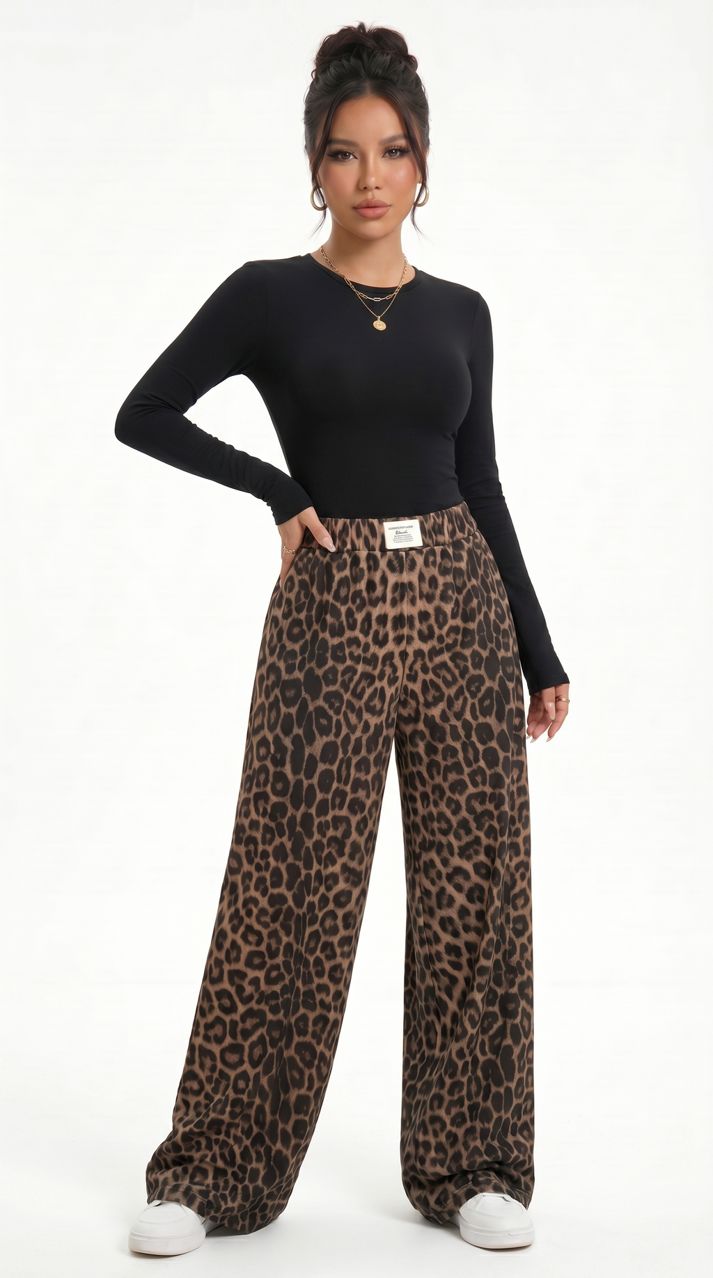 Woman wearing a black long-sleeve top and leopard print pants on a white background, sexy pants from Meleche Fashion USA or Meléche (short as (Mé))