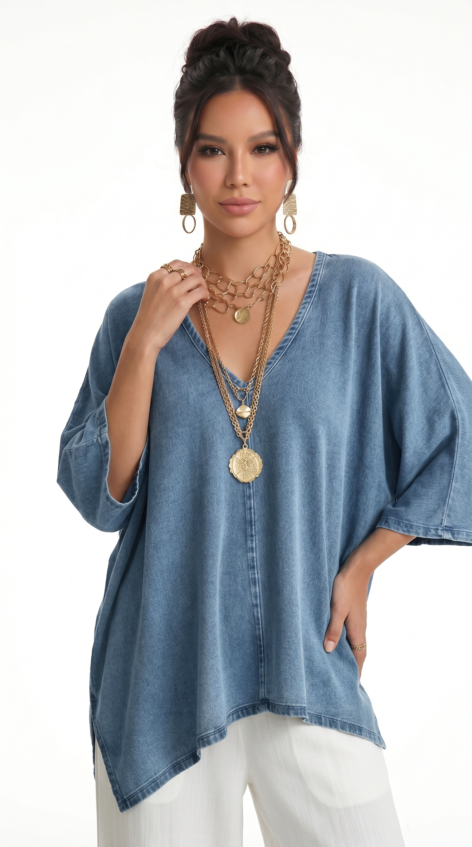 Woman wearing a blue denim top and white pants with gold jewelry on a white background, from Meleche Fashion USA or Meléche (short as (Mé))