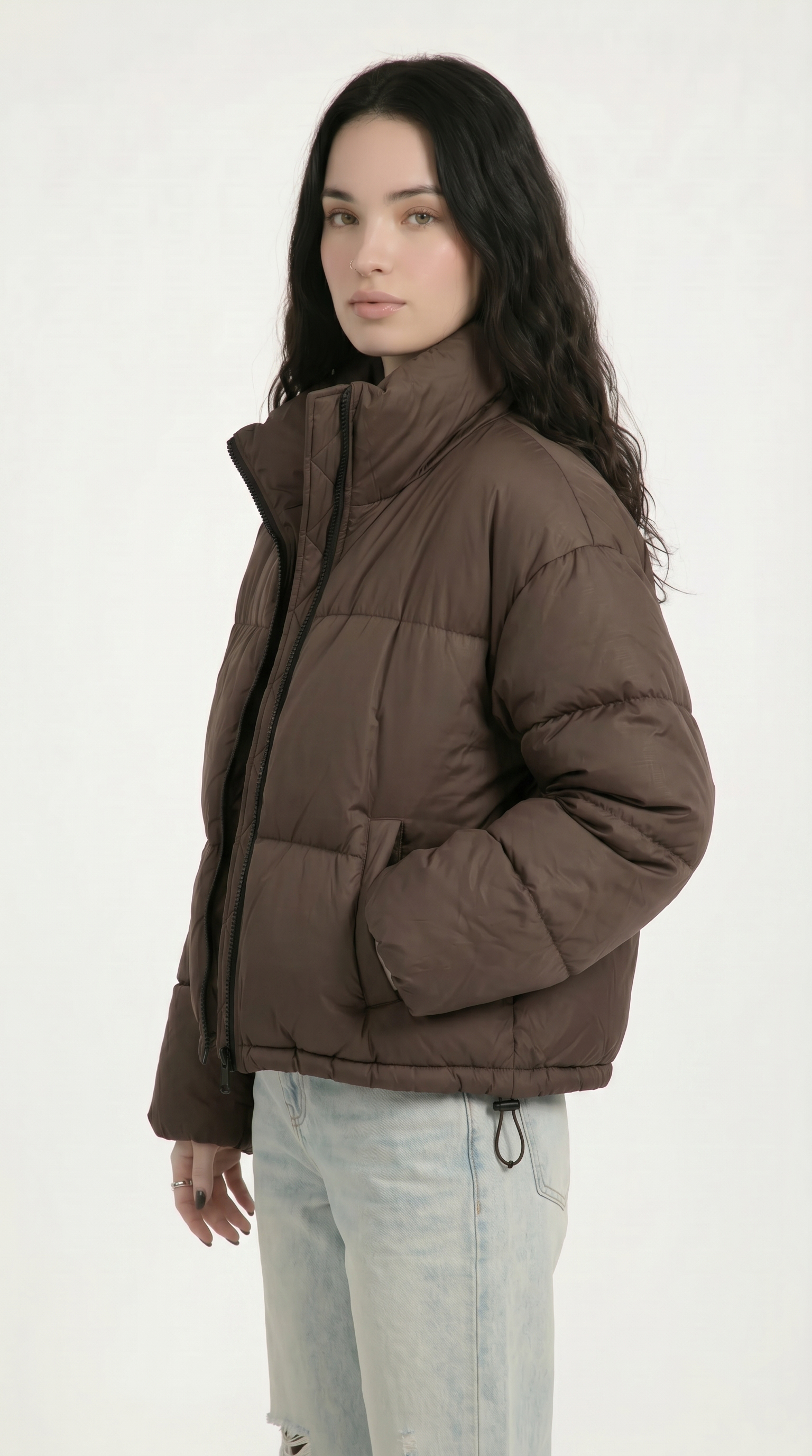 Woman wearing a brown puffer jacket on a white background from Meleche or Meléche USA (short as (Mé))