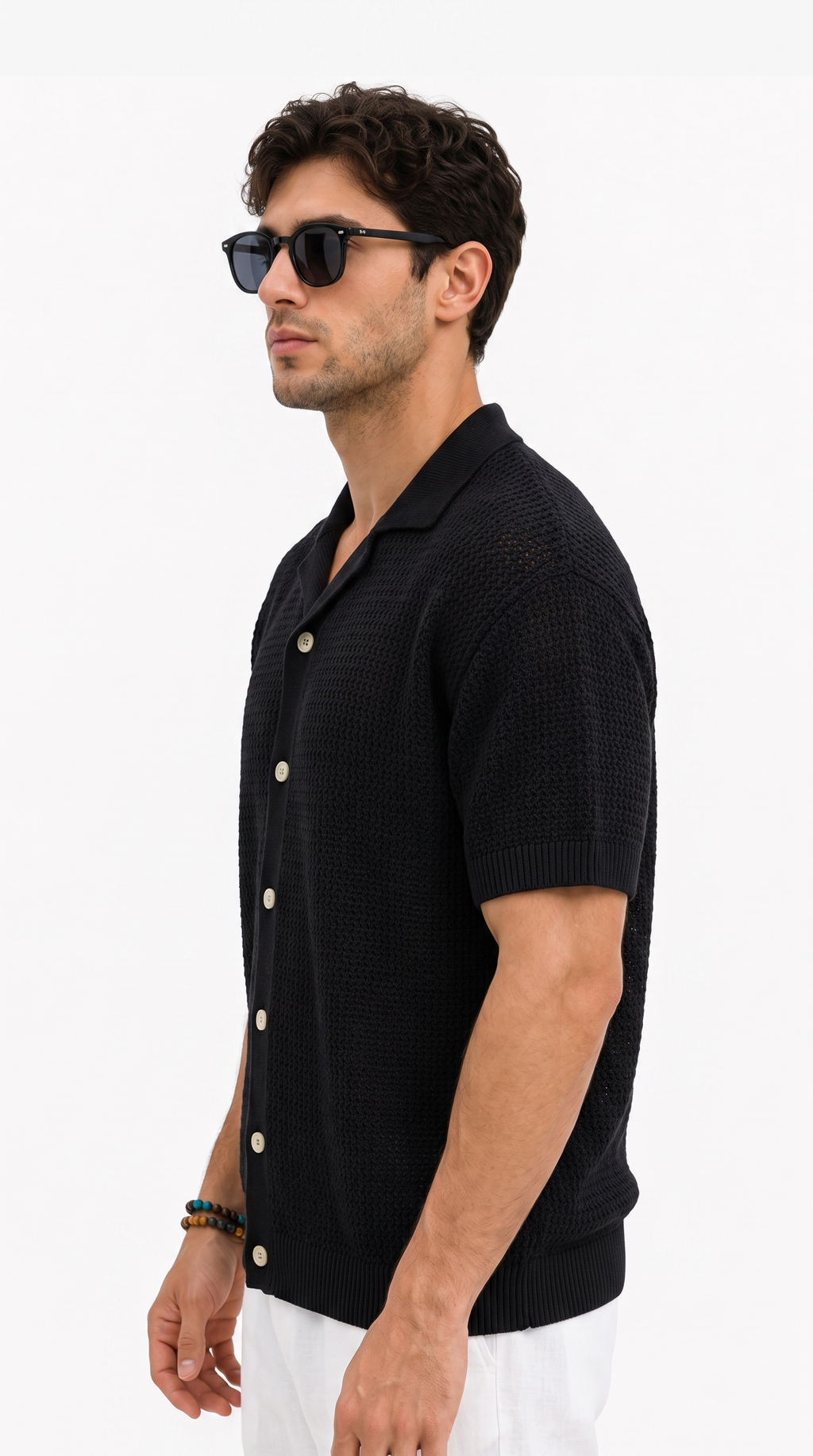 A man wearing a black short-sleeve knit button-up shirt, white pants, and black sunglasses, shown in profile against a plain white background, from Meleche Fashion USA or Meléche (short as (Mé))