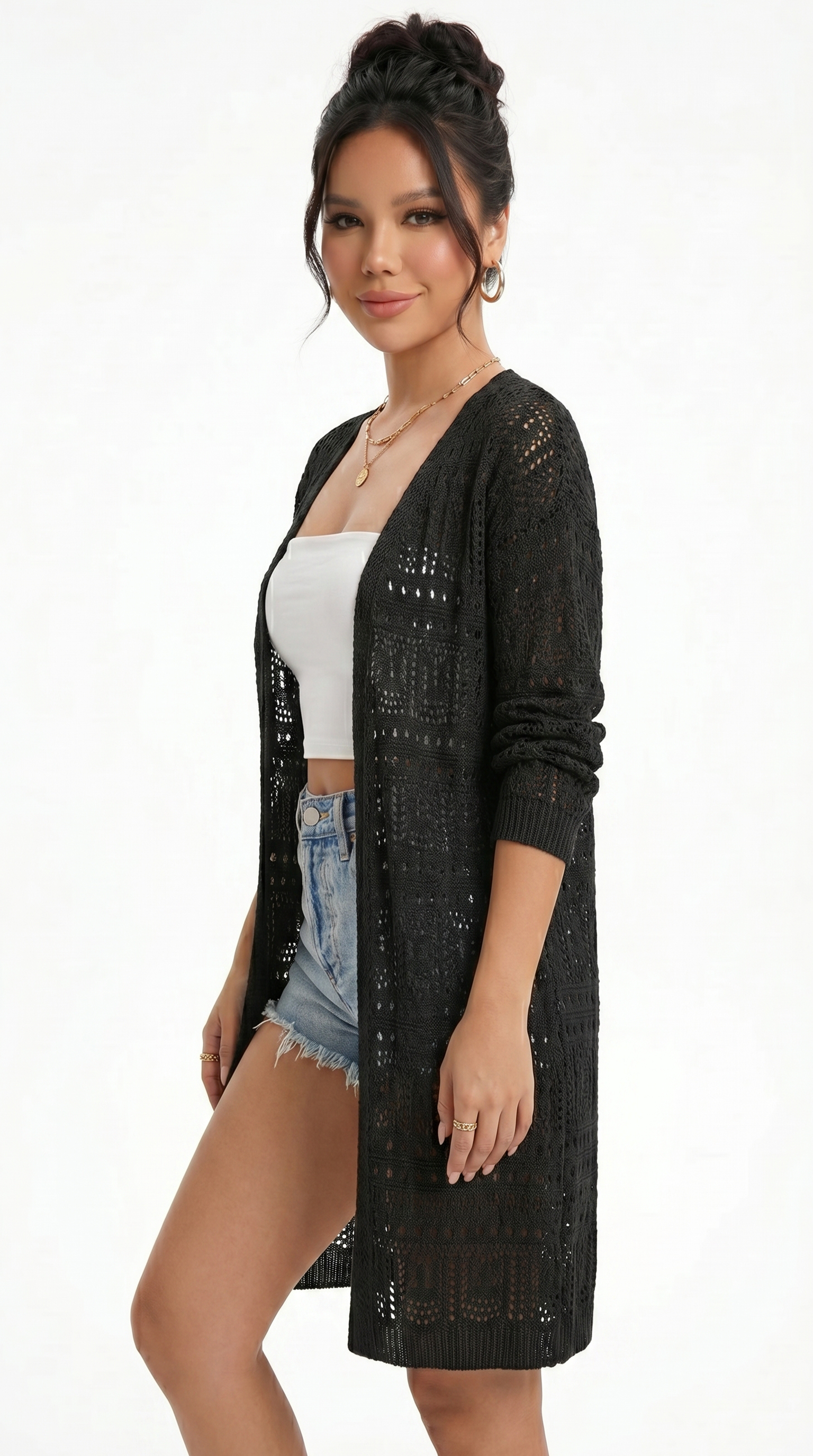 Woman wearing a black cardigan over a white top and denim shorts on a white background from Meleche or Meléche (short as (Mé))