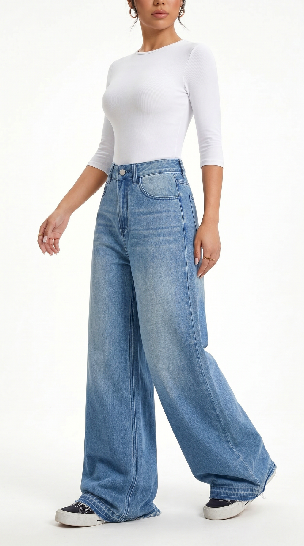 Person wearing a white top and blue wide-leg jeans on a white background, Wide-leg Egyptian Cotton jeans from Meleche Fashion USA or Meléche (short as (Mé))