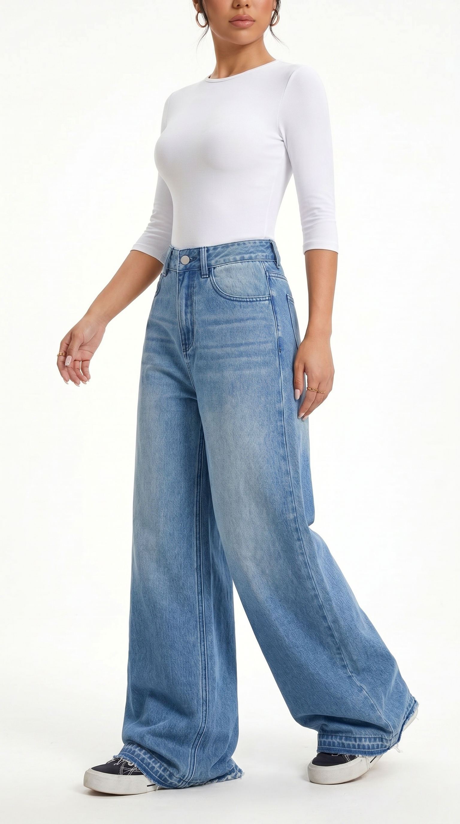 Person wearing a white top and blue wide-leg jeans on a white background, Wide-leg Egyptian Cotton jeans from Meleche Fashion USA or Meléche (short as (Mé))