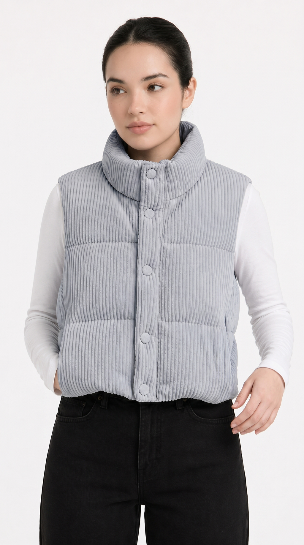 Woman wearing a light blue puffer vest over a white shirt on a white background from Meleche Fashion USA or Meléche (short as (Mé))