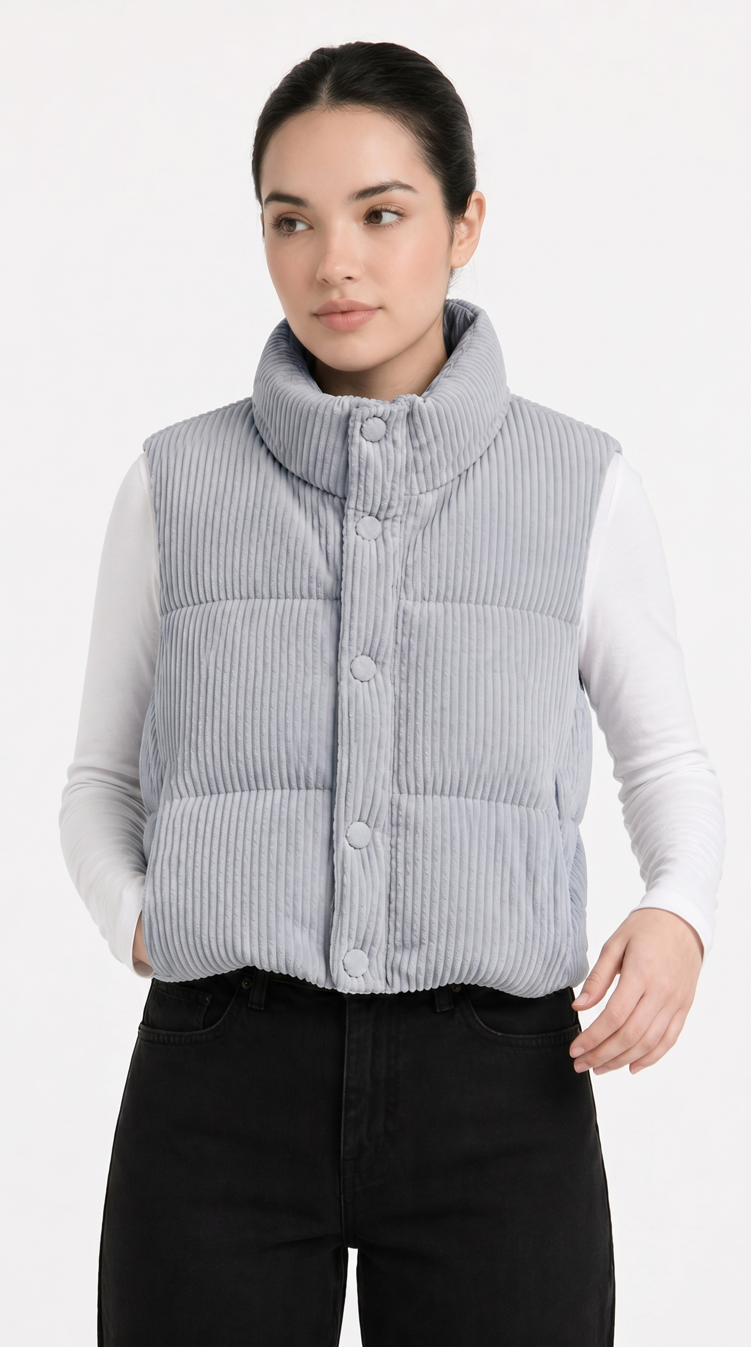 Woman wearing a light blue puffer vest over a white shirt on a white background from Meleche Fashion USA or Meléche (short as (Mé))