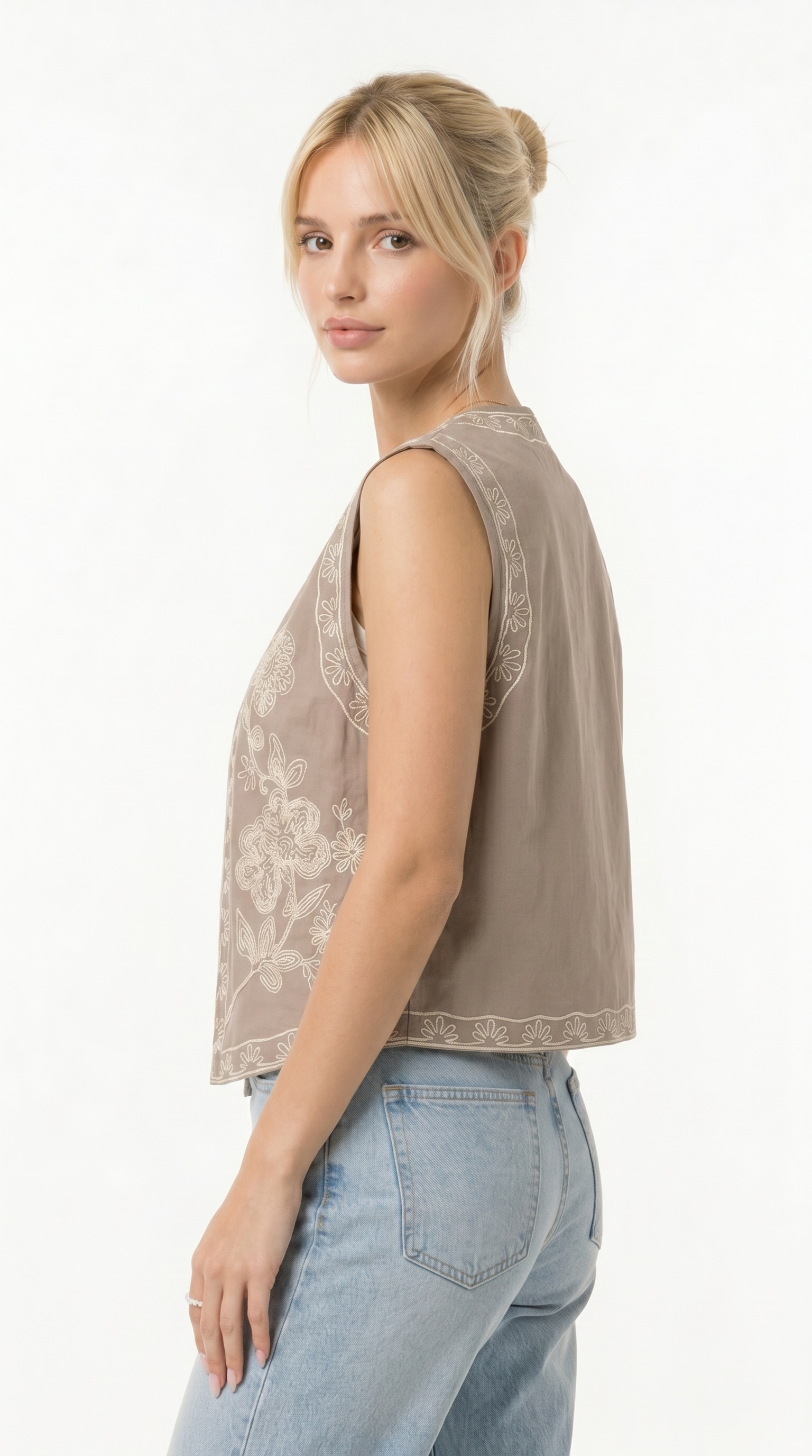Woman wearing a beige sleeveless top with lace detailing on a white background from Meleche Fashion USA or Meléche (short as (Mé))