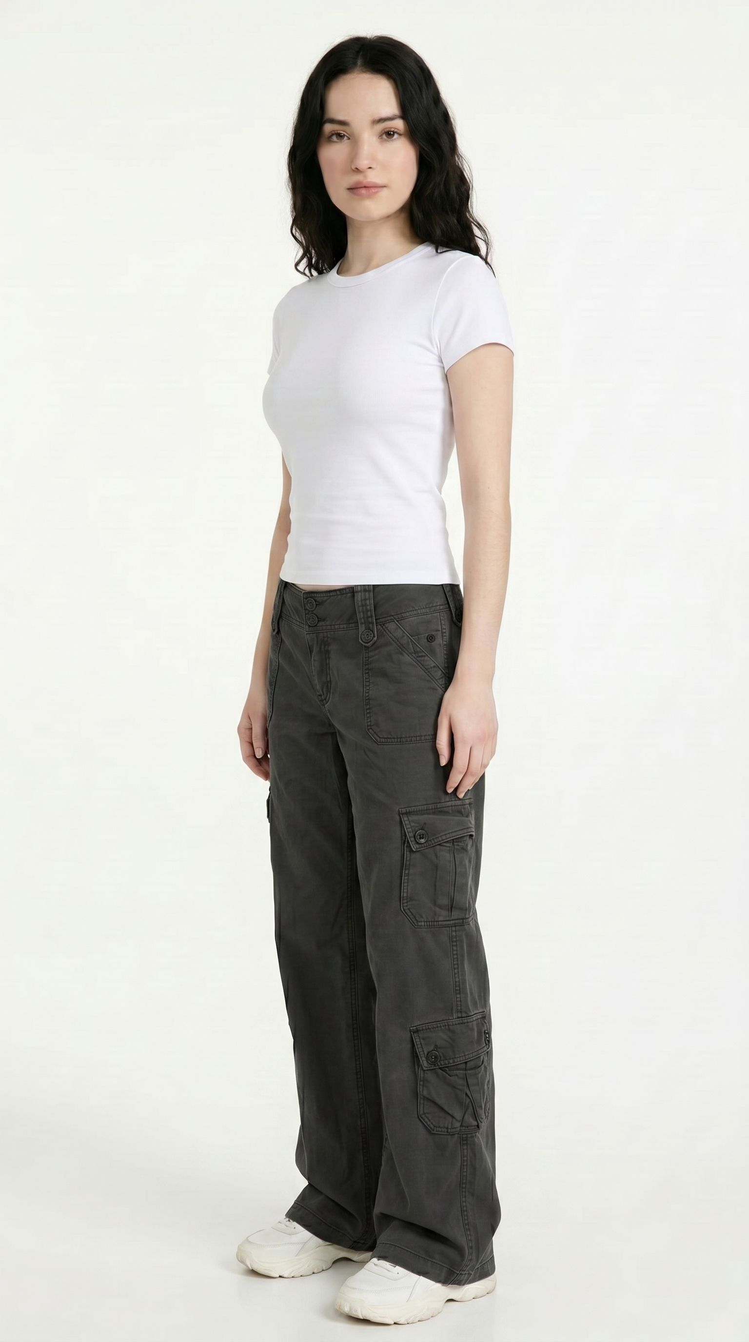 Woman wearing a white t-shirt and dark cargo pants on a white background, from Meleche Fashion USA or Meléche (short as (Mé))