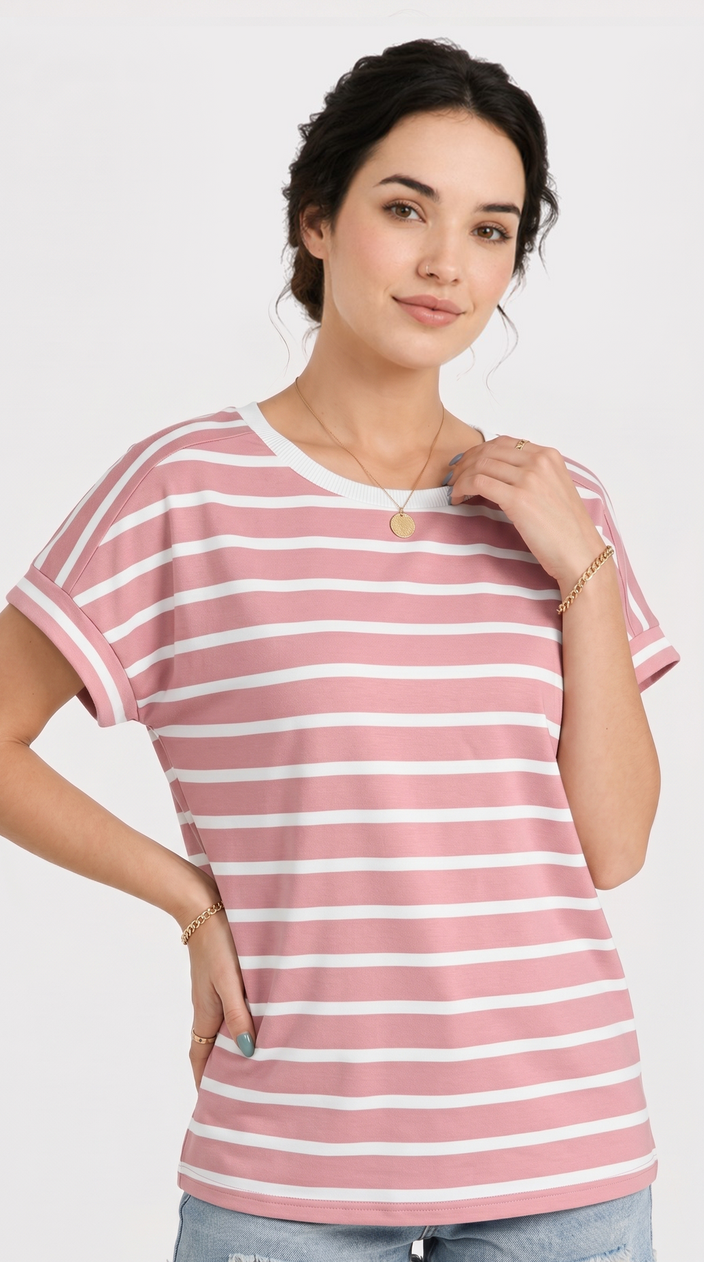 Woman wearing a pink and white striped t-shirt on a plain background, from Meleche Fashion USA or Meléche (short as (Mé))