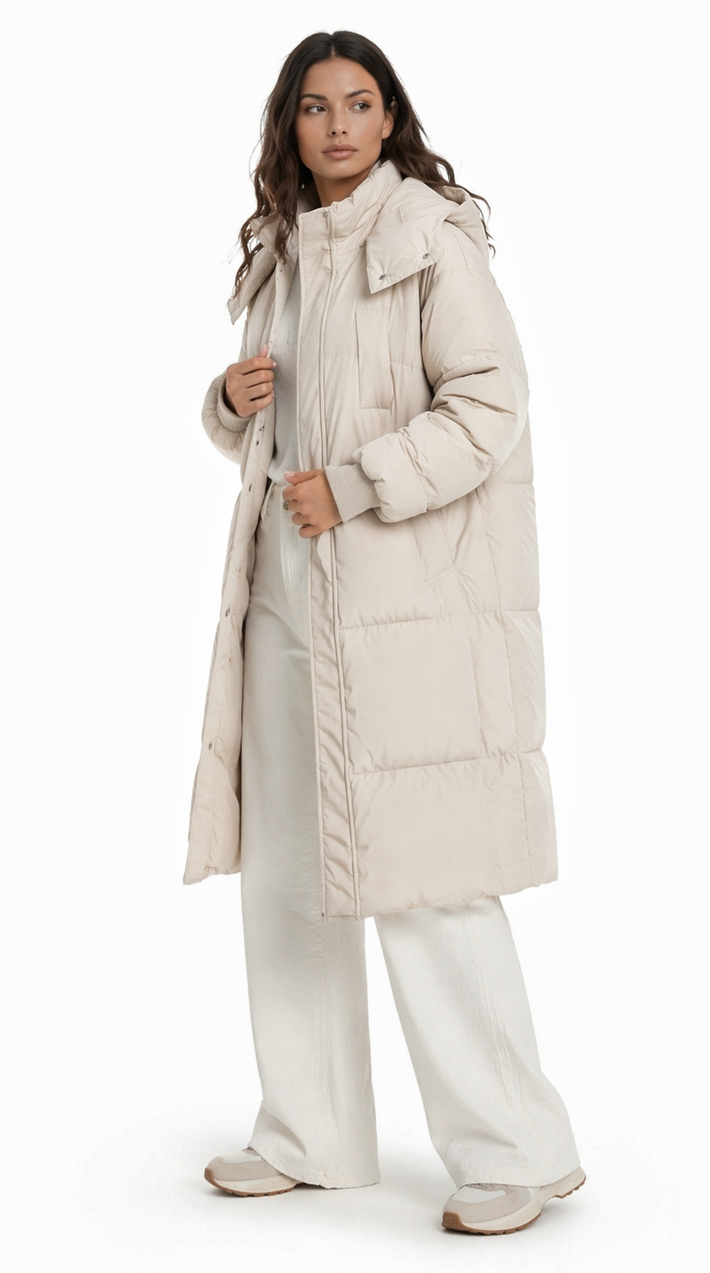 Woman wearing a long beige puffer coat on a white background from Meleche Fashion USA or Meléche (short as (Mé))