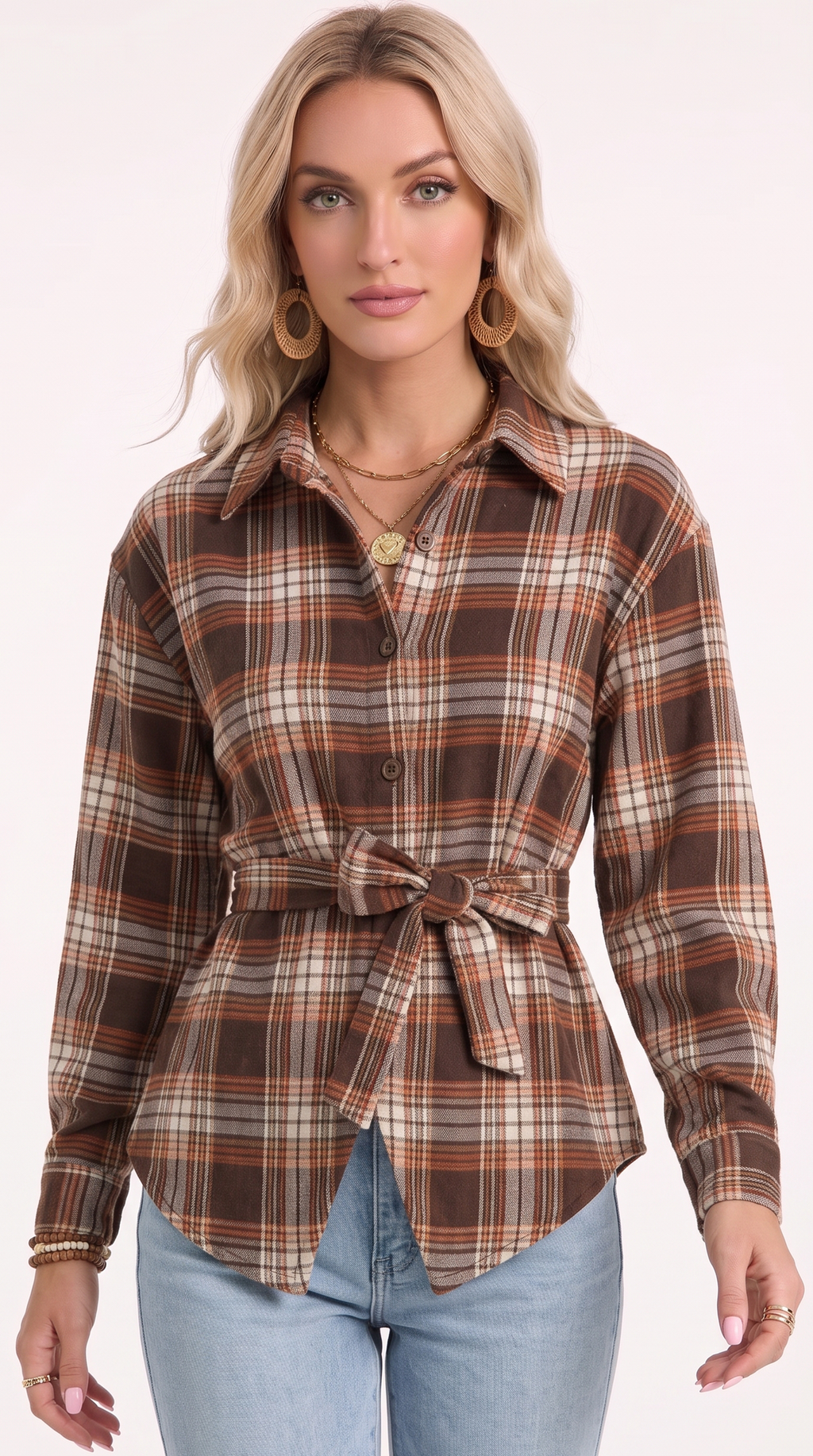 A woman modeling a brown, beige, and orange plaid long-sleeve button-up shirt with a matching tie belt, paired with light blue jeans against a plain white studio background, from Meleche Fashion USA or Meléche (short as (Mé))