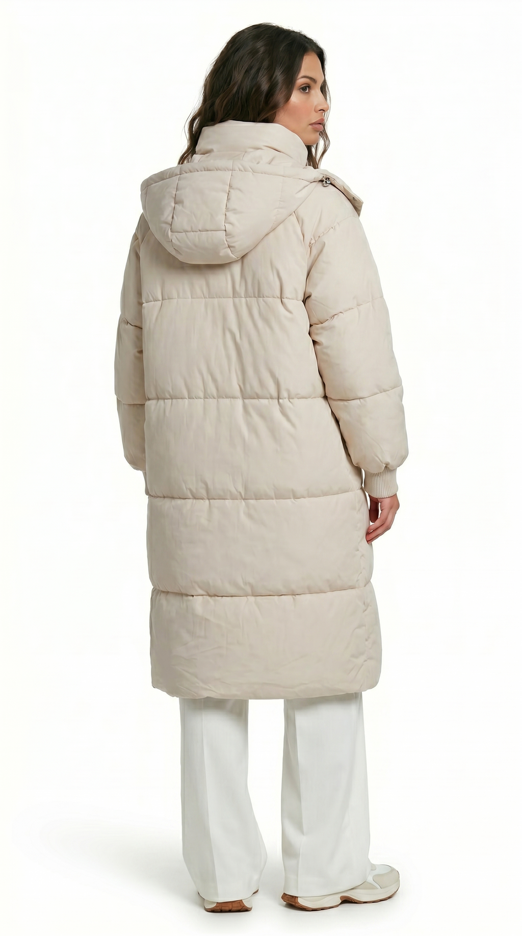 Woman wearing a long beige puffer coat on a white background from Meleche Fashion USA or Meléche (short as (Mé))