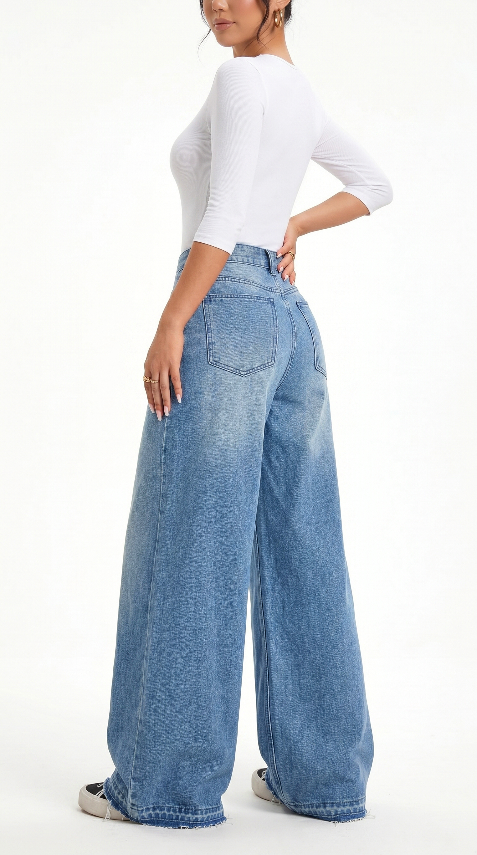 Person wearing light blue wide-leg jeans and a white top on a white background, Wide-leg Egyptian Cotton jeans from Meleche Fashion USA or Meléche (short as (Mé))