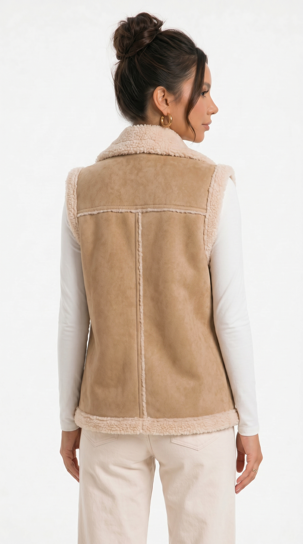 Woman wearing a beige shearling vest on a white background from Meleche Fashion USA or Meléche (short as (Mé))