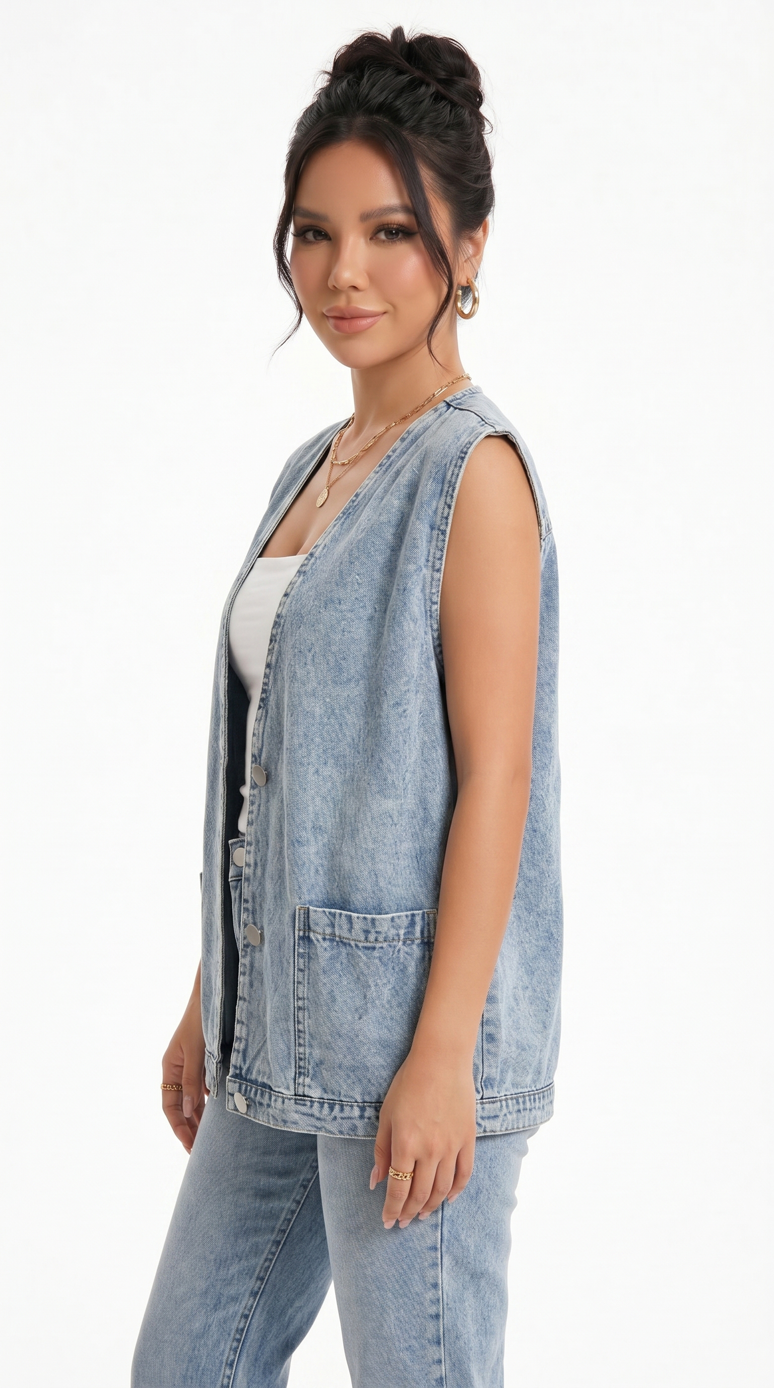 Woman wearing a light blue denim vest over a white top on a white background from Meleche Fashion USA or Meléche (short as (Mé))