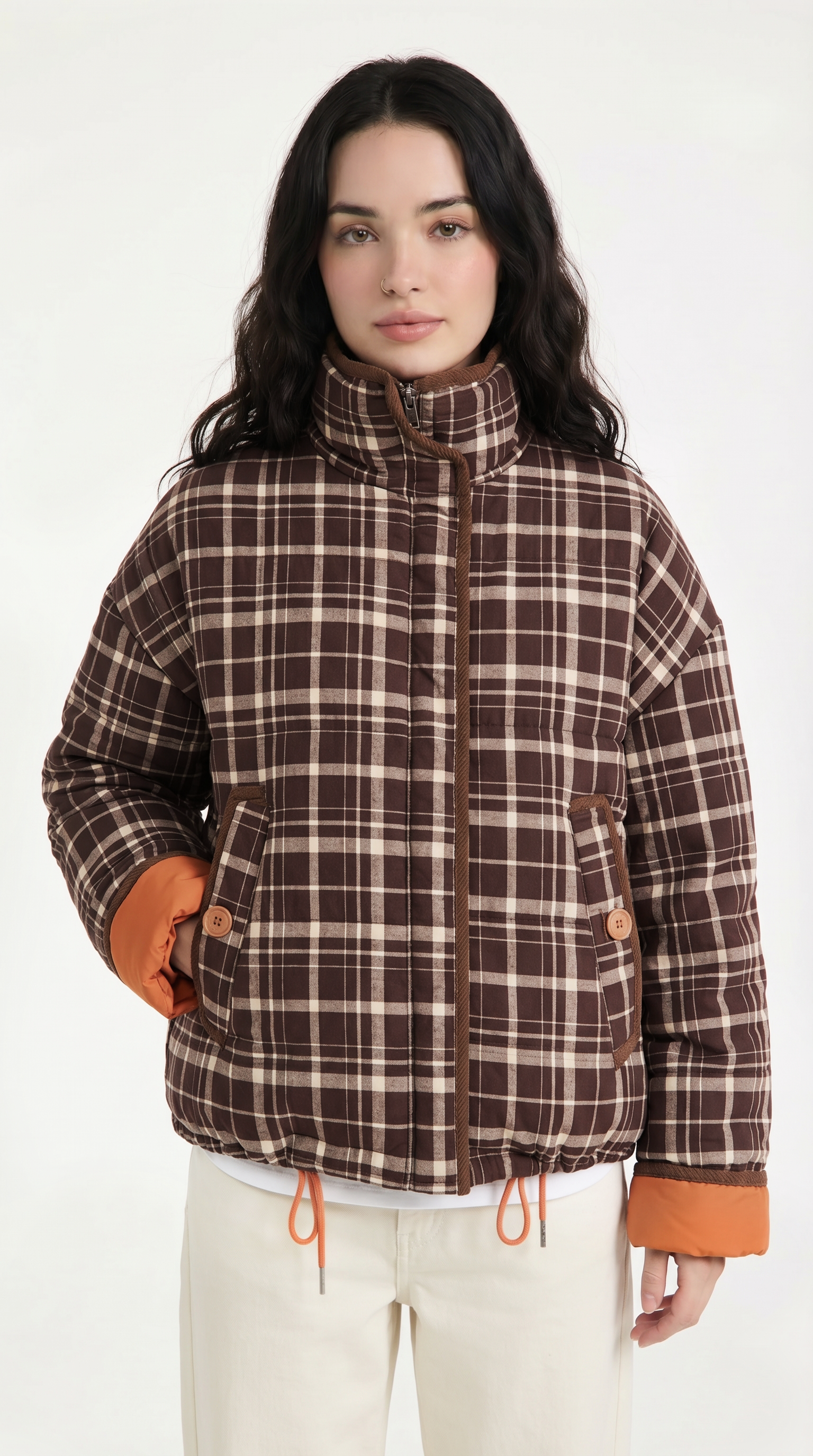Woman wearing a plaid jacket with orange accents on a white background from Meleche or Meléche USA (short as (Mé))