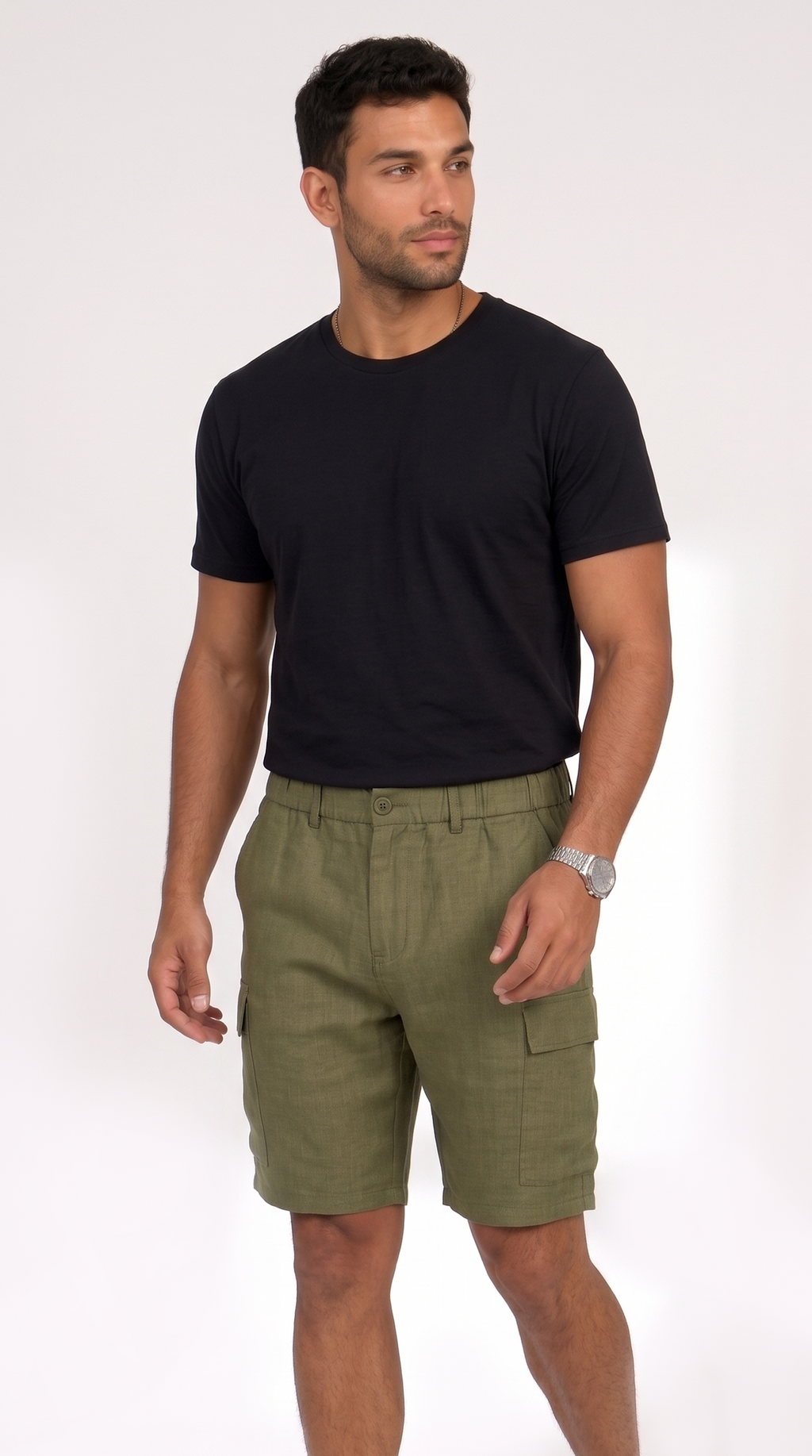 A man wearing a black short-sleeve crewneck t-shirt and olive green cargo shorts, standing against a plain white studio background, from Meleche Fashion USA or Meléche (short as (Mé))