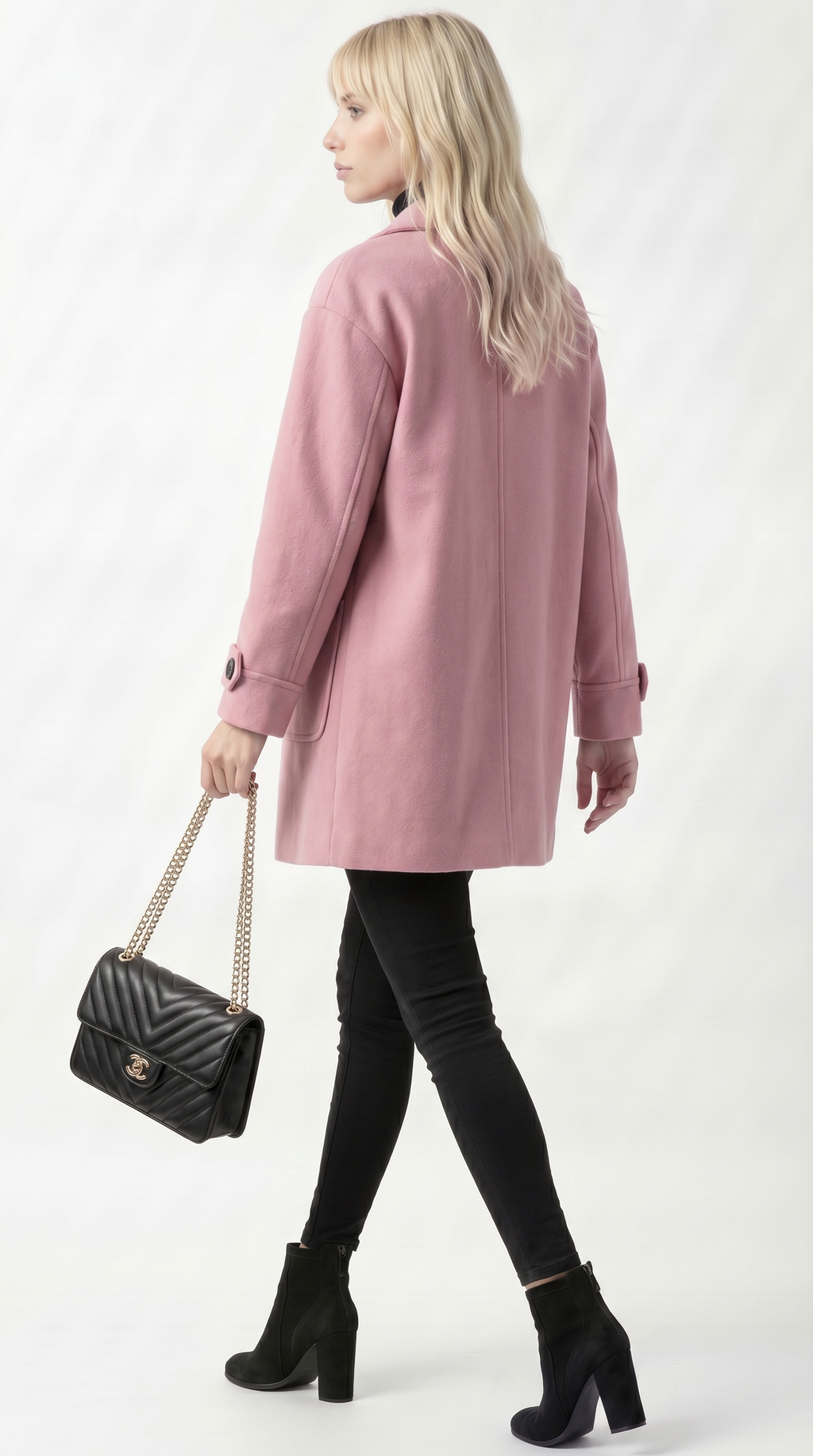 Woman wearing a pink coat with a black handbag on a white background from Meleche USA or Meléche (short as (Mé))