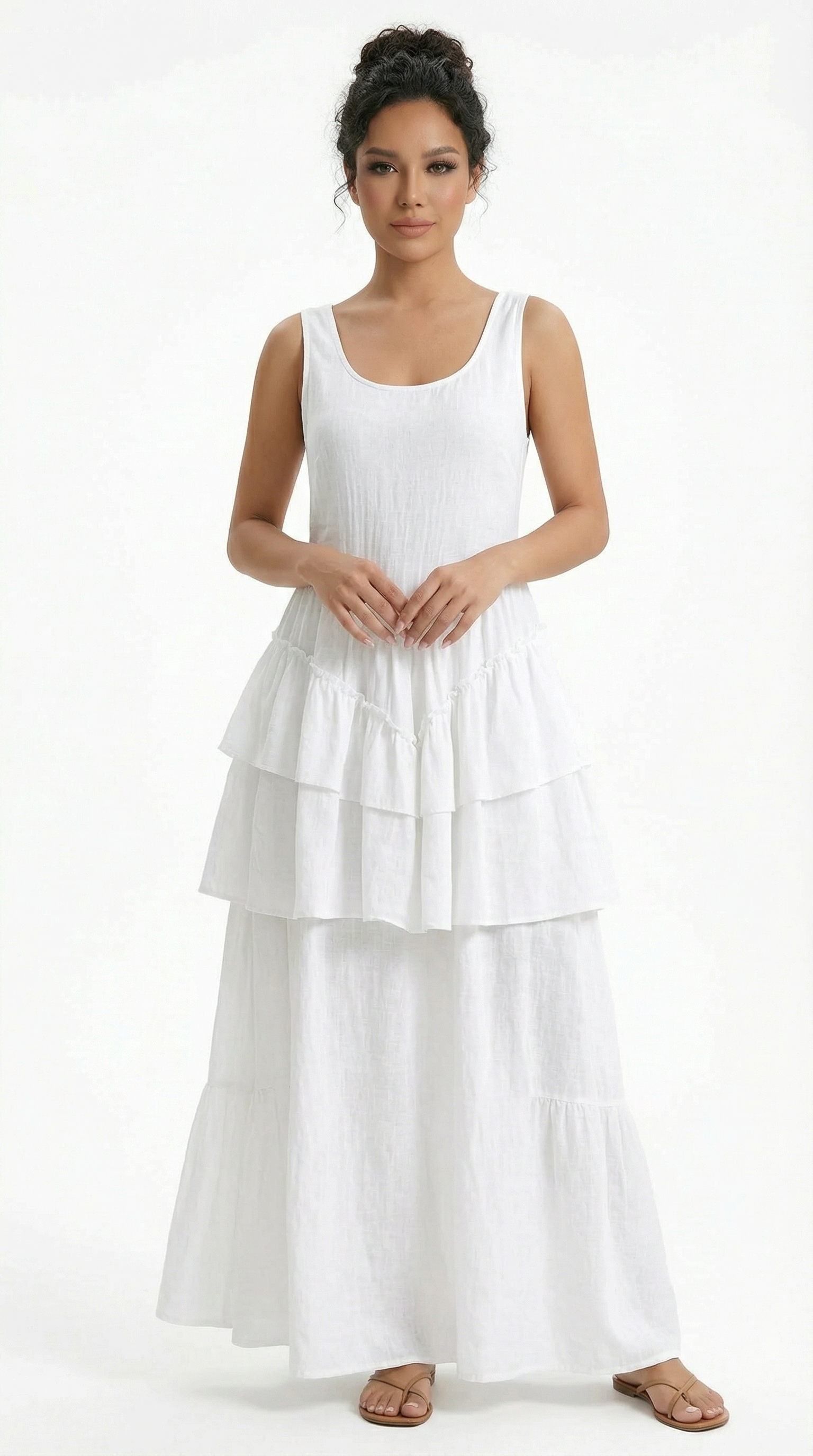 Woman wearing a green dress with ruffled details on a white background