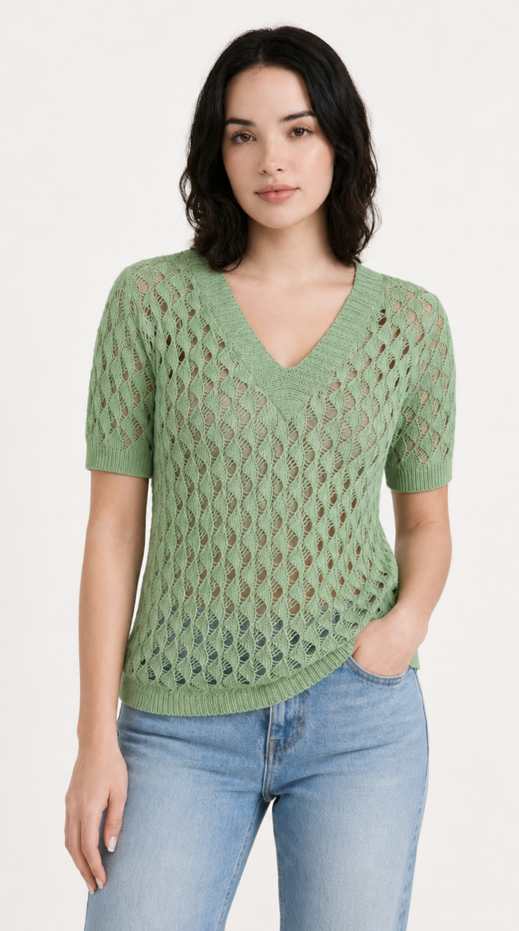 Woman wearing a green knitted sweater and blue jeans on a white background, from Meleche Fashion USA or Meléche (short as (Mé))