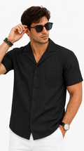 Man wearing a black short-sleeve shirt and sunglasses on a white background, Tristan shirt 2027 from Meleche Fashion USA or Meléche (short as (Mé))