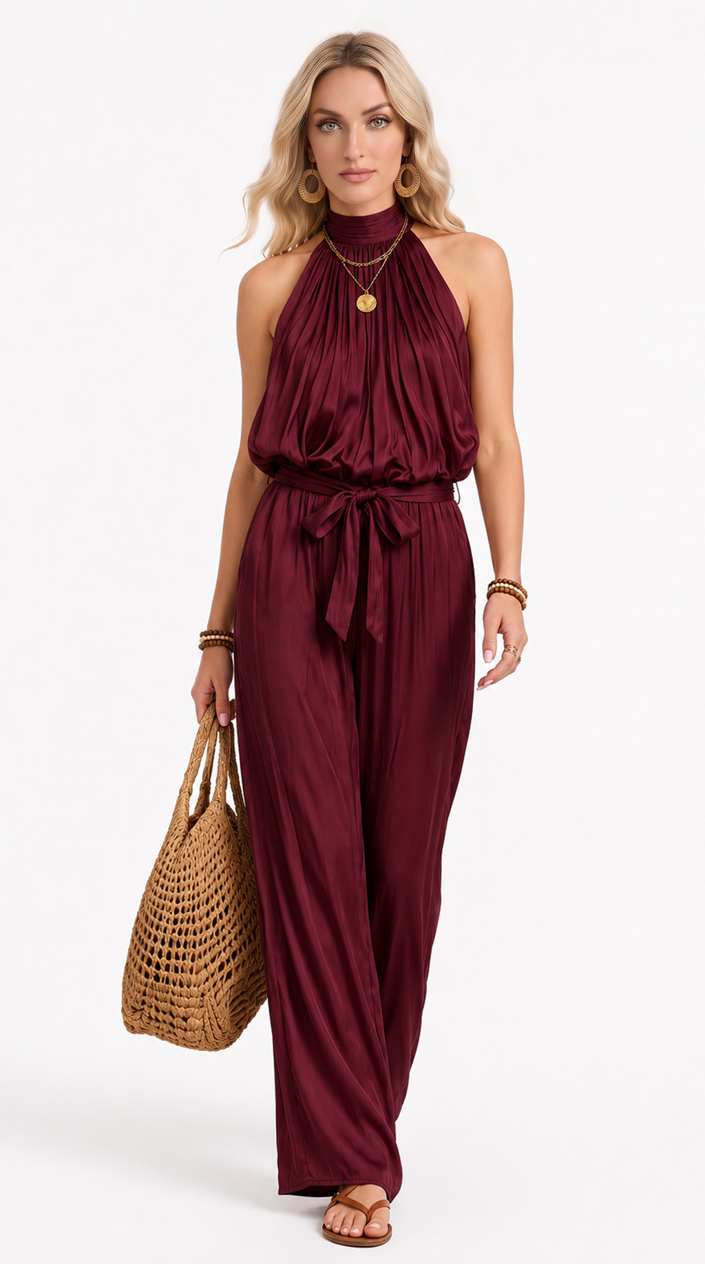 Woman wearing a burgundy jumpsuit holding a woven bag on a white background, from Meleche Fashion USA or Meléche (short as (Mé))