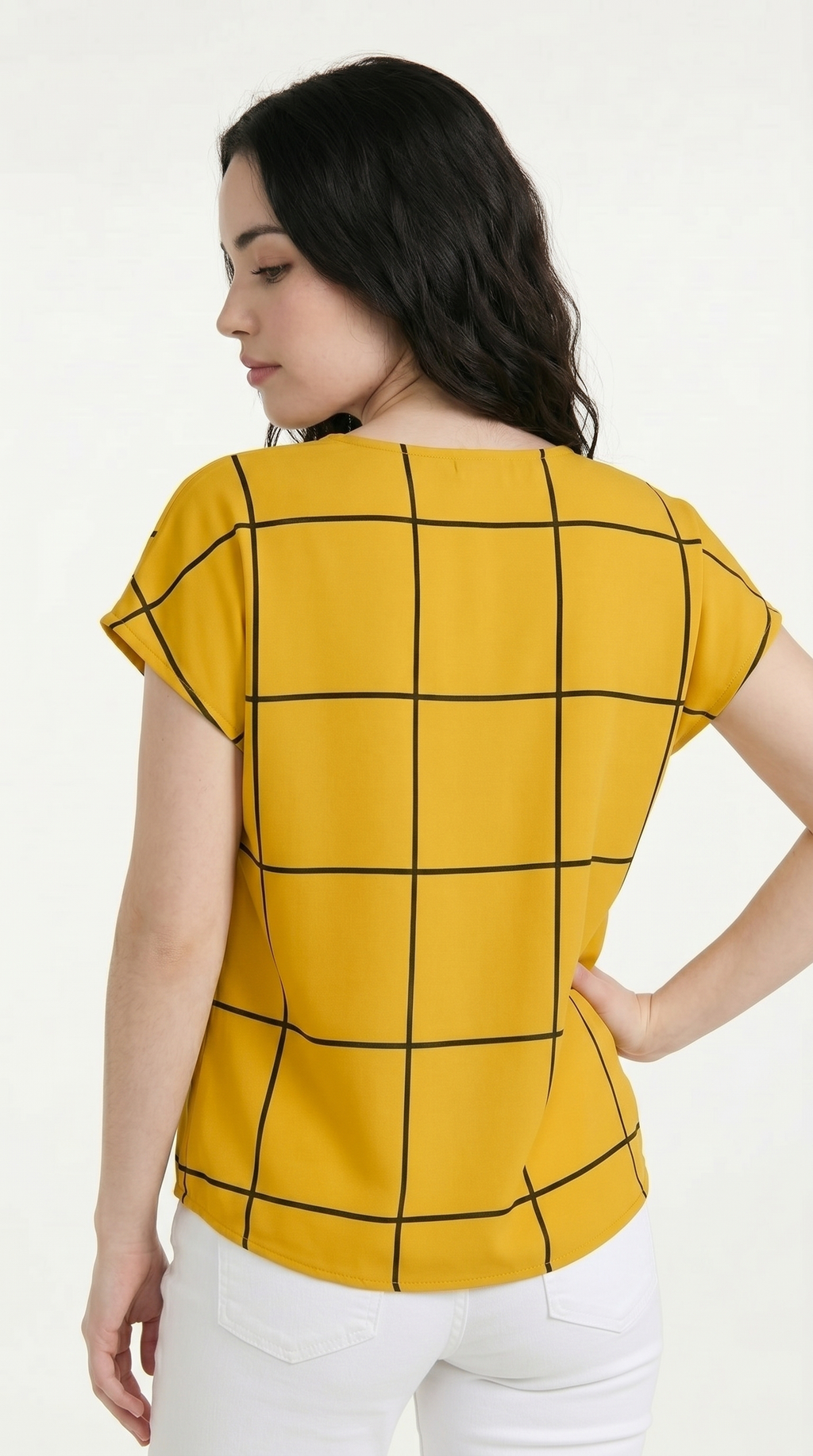 Woman wearing a mustard yellow top with black grid pattern on a white background, from Meleche Fashion USA or Meléche (short as (Mé))
