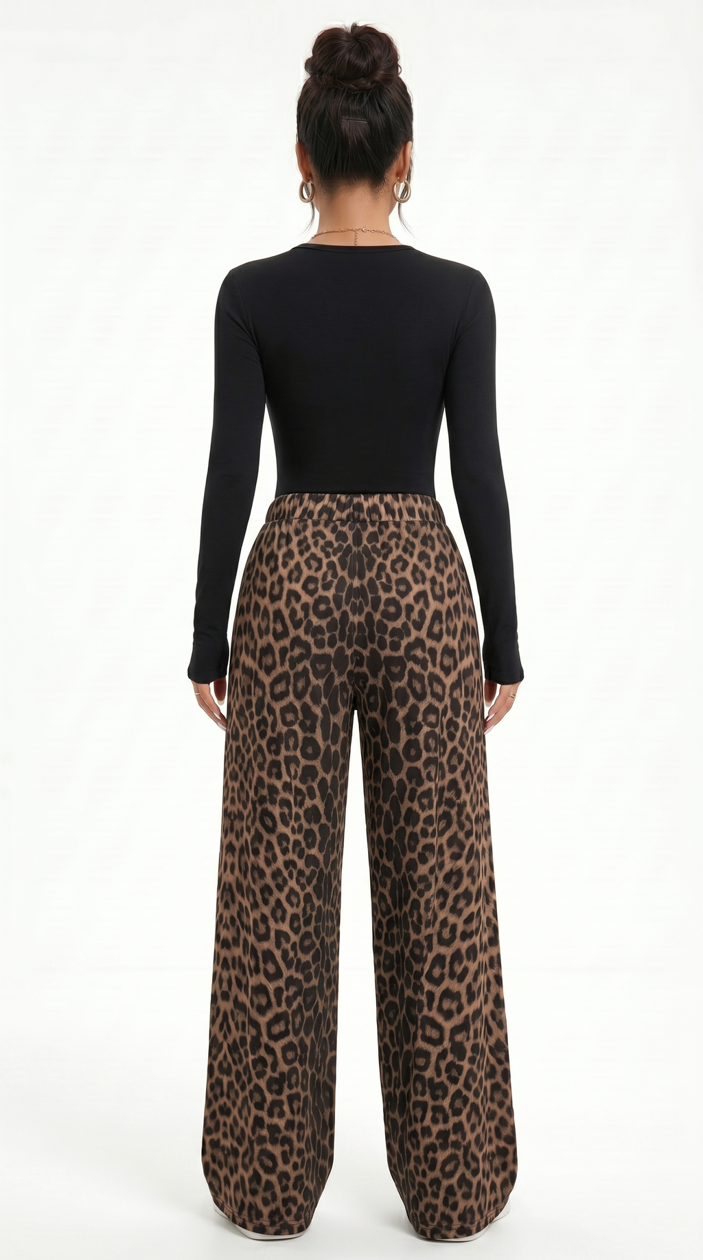 Person wearing a black long-sleeve top and leopard print pants on a white background, sexy pants from Meleche Fashion USA or Meléche (short as (Mé))