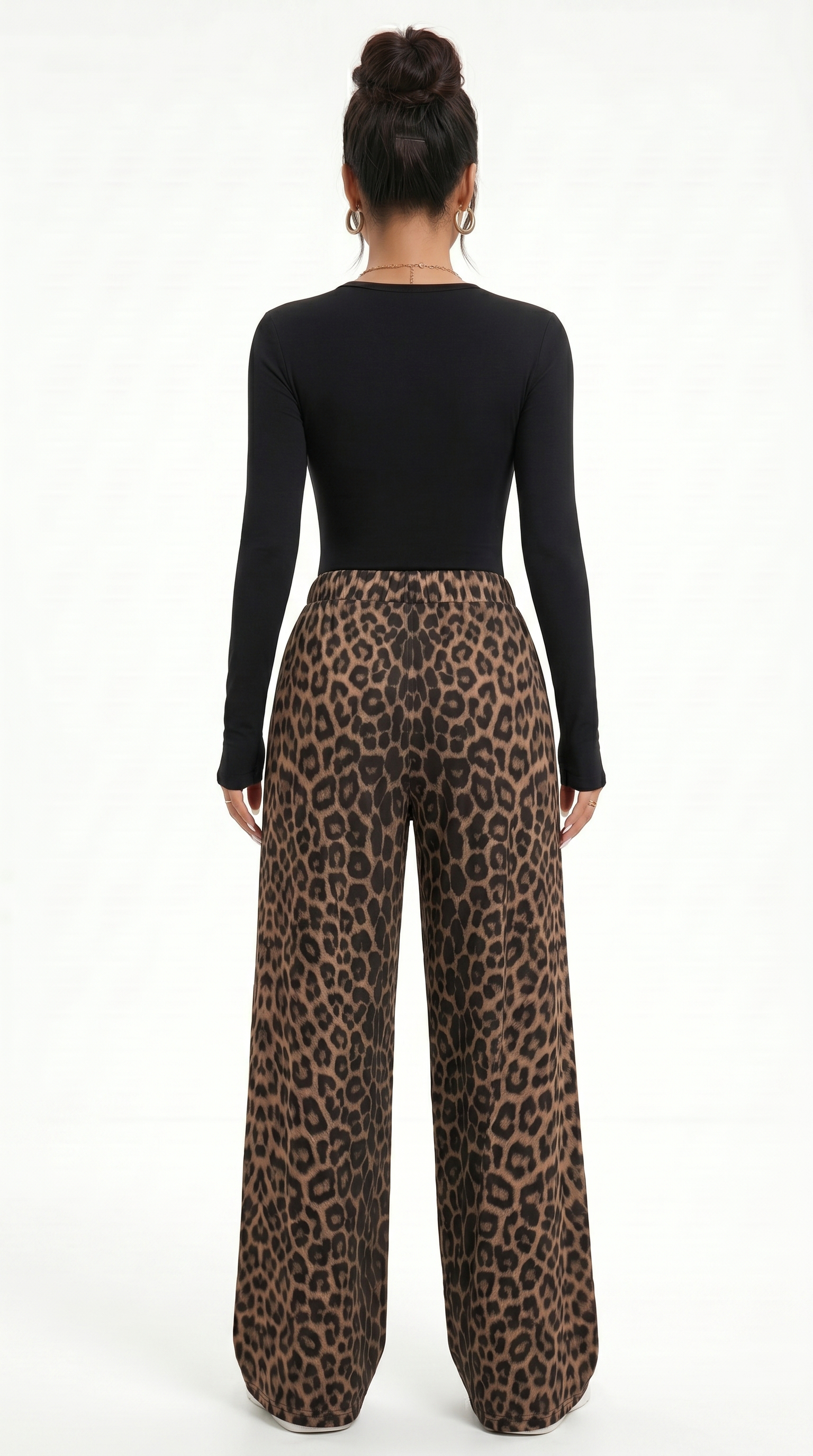 Person wearing a black long-sleeve top and leopard print pants on a white background, sexy pants from Meleche Fashion USA or Meléche (short as (Mé))