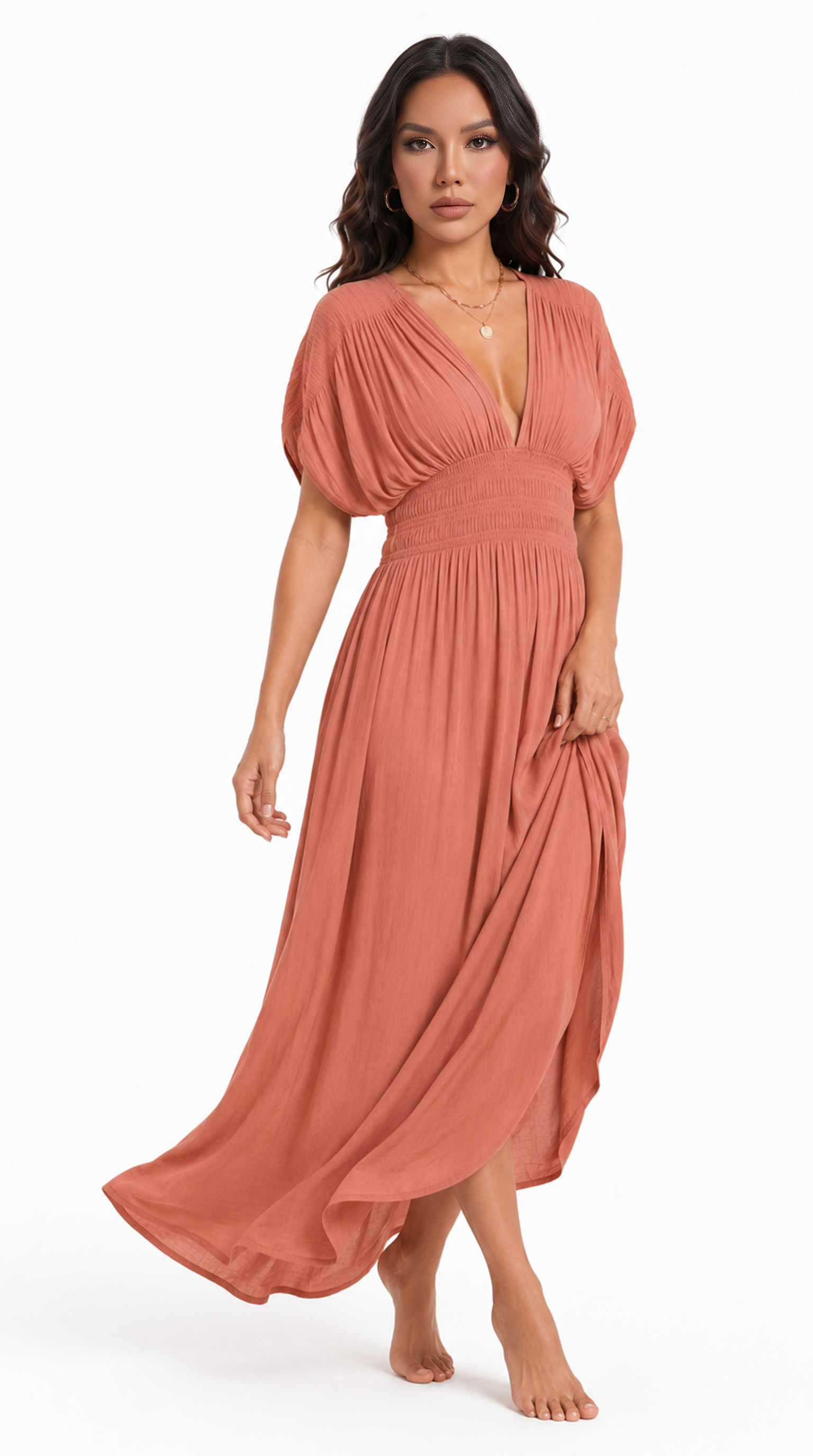 A woman modeling a flowing terracotta maxi dress with a deep V-neckline, short puff sleeves, and a gathered waist, set against a plain white studio background, from Meleche Fashion USA or Meléche (short as (Mé))