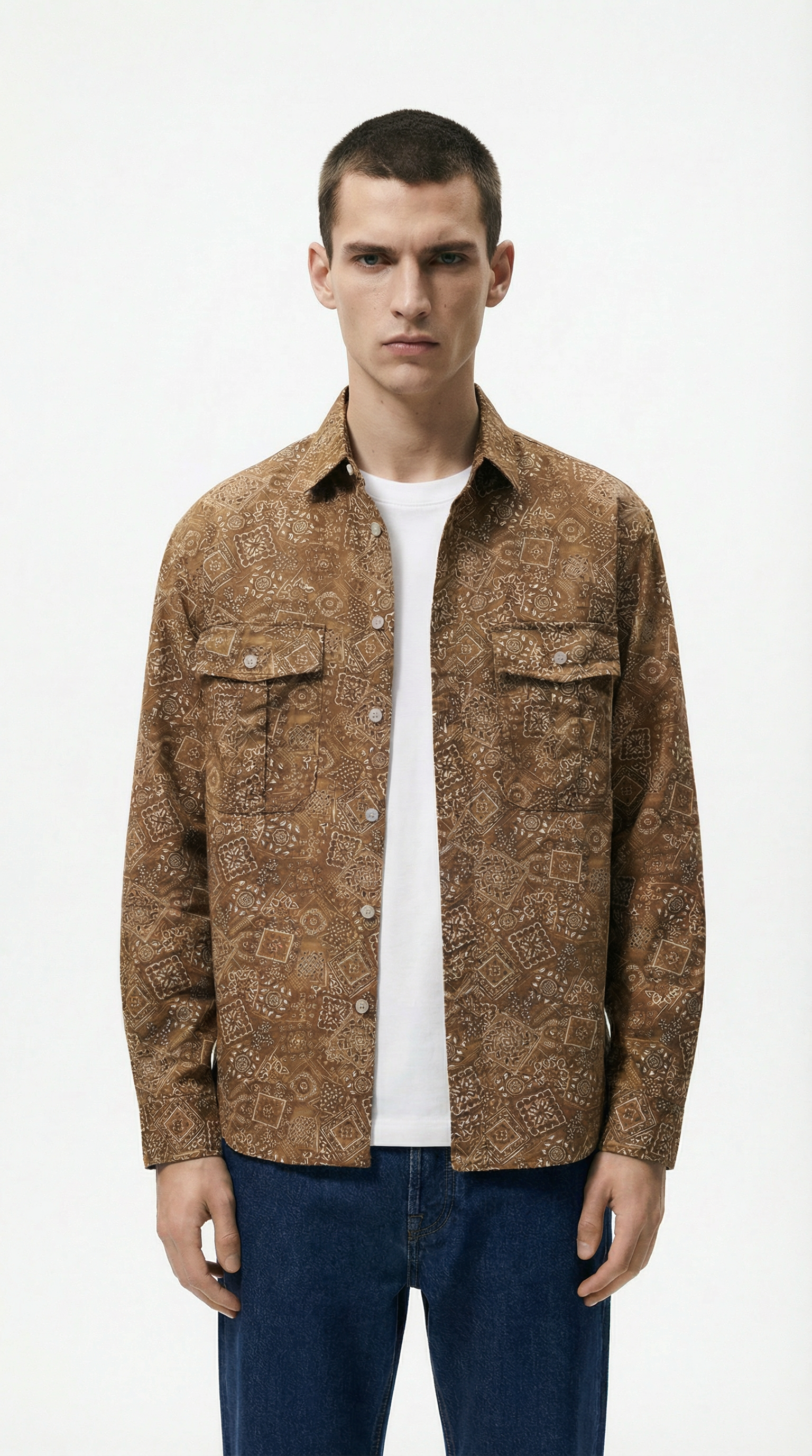 Man wearing a patterned brown jacket over a white shirt from Meleche or Meléche (short as (Mé))